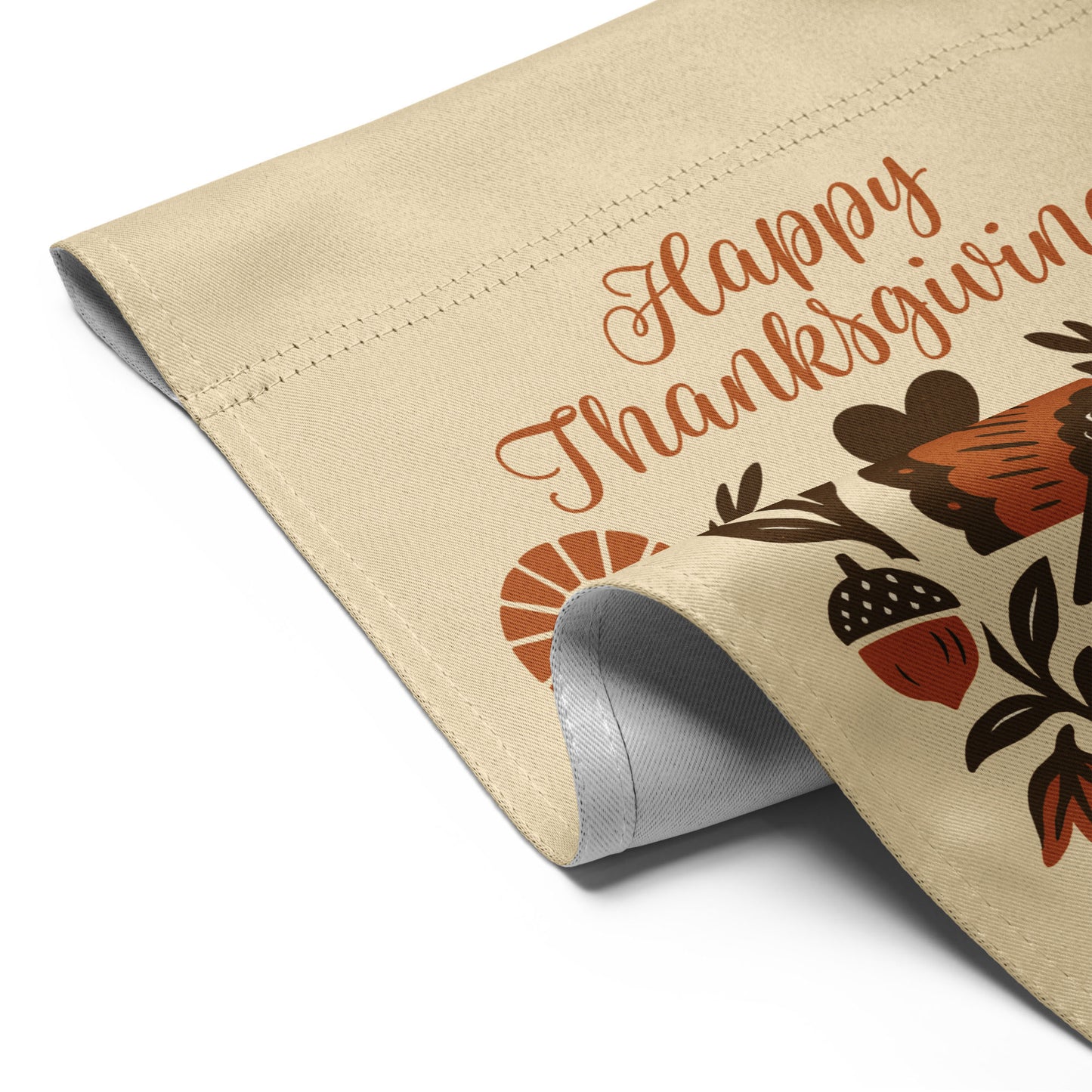 Close-up of the “Happy Thanksgiving – Celebrating Immigrants Since 1620” garden flag showing stitched hem and partial turkey/lettering detail.