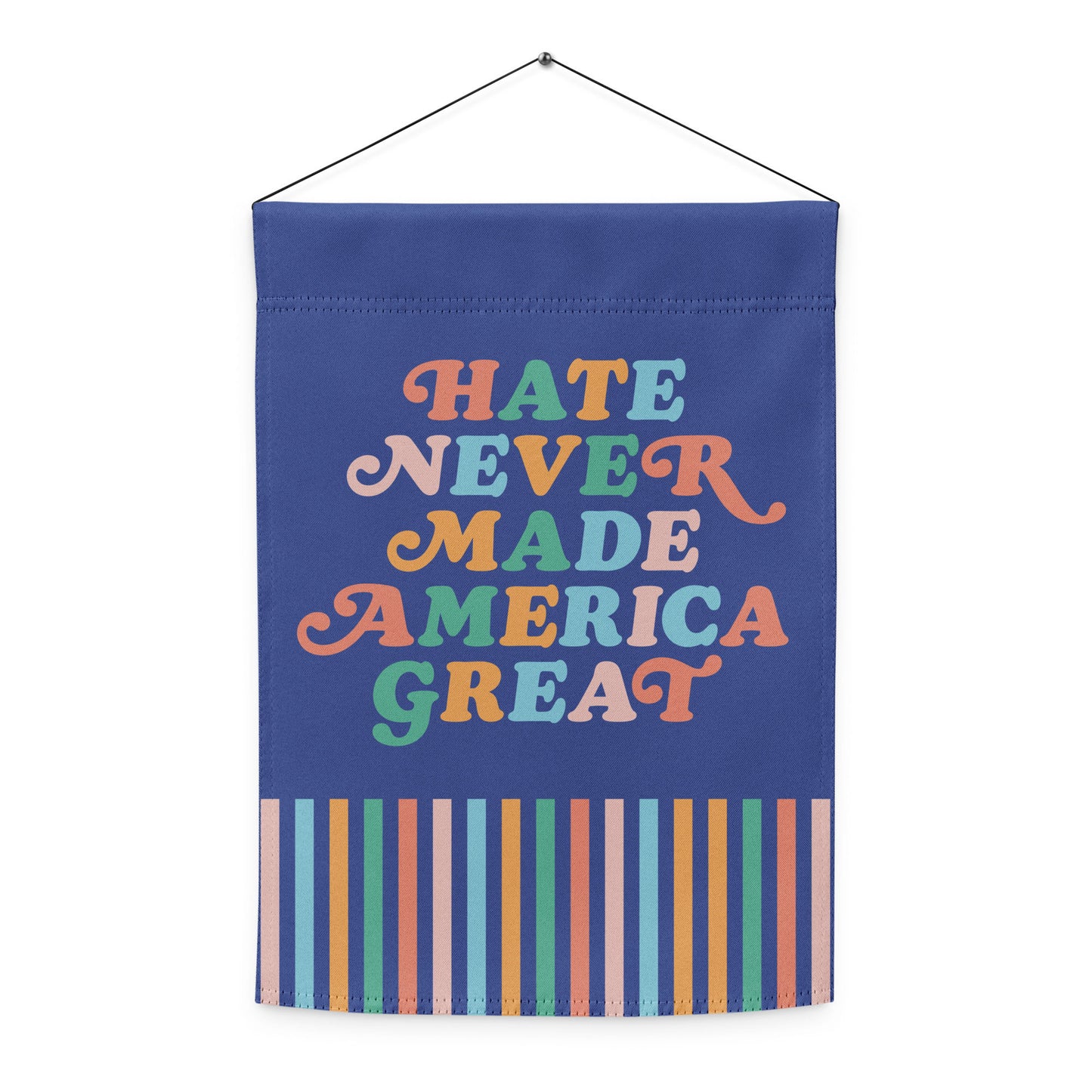 Front view of the “Hate Never Made America Great” garden flag with bold multicolor lettering and striped bottom design.