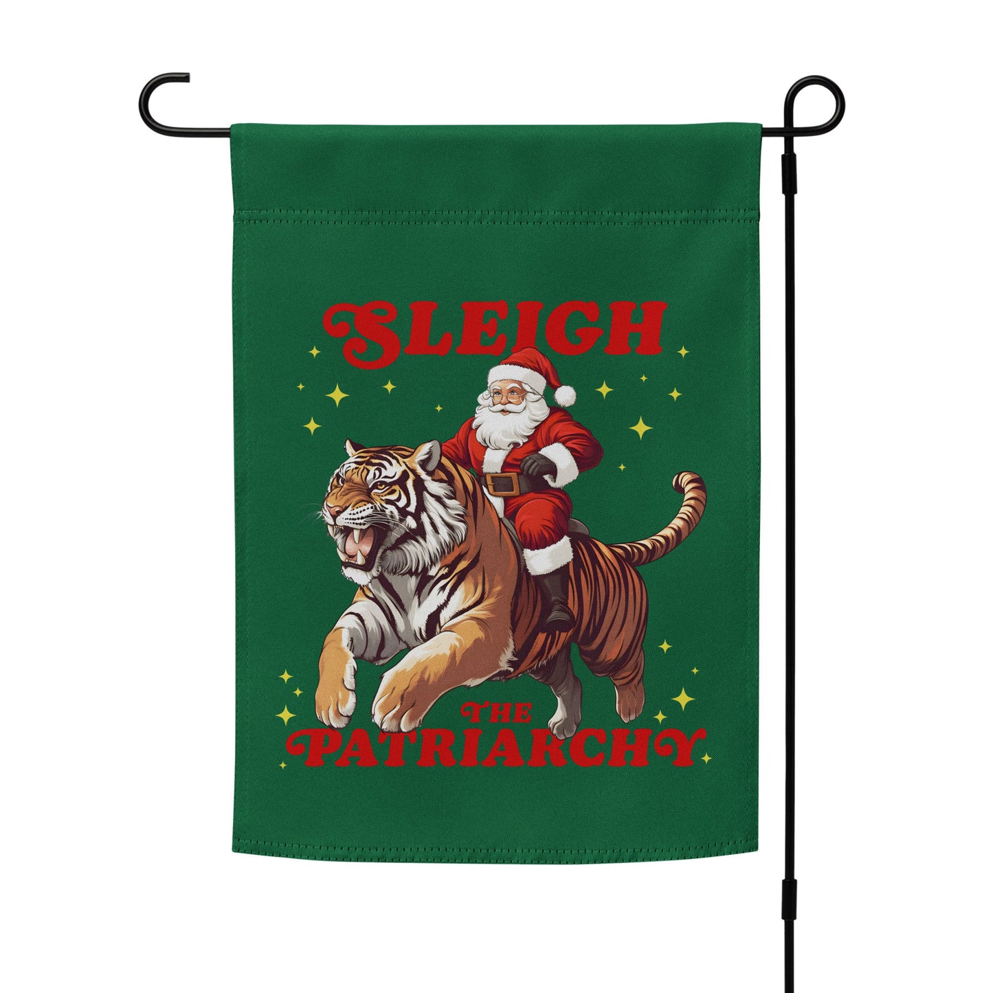 “Sleigh the Patriarchy” feminist holiday garden flag with Santa riding tiger design, displayed outdoors on a flag stand, Blue Wave USA progressive products.