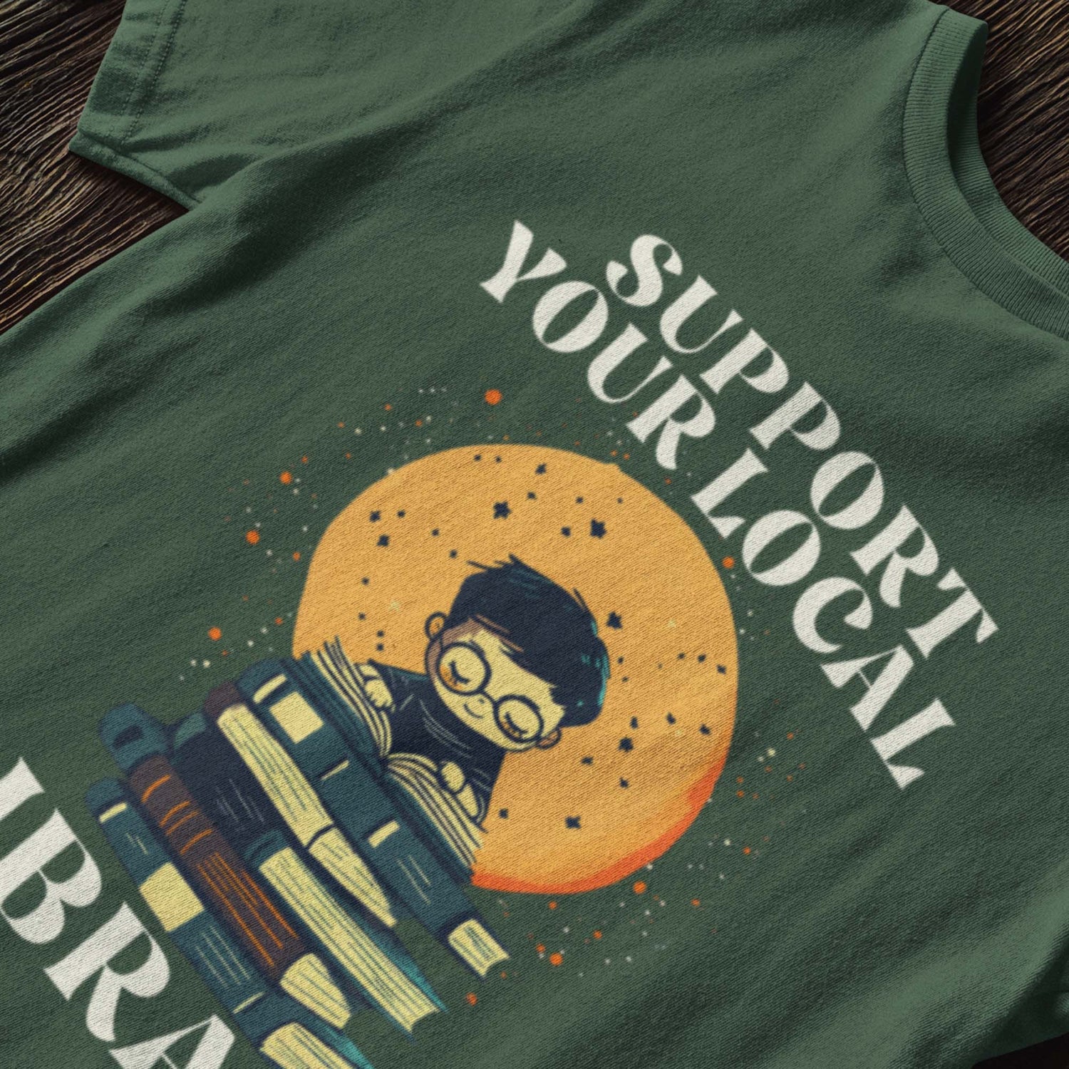 Flat lay of the "Support Your Local Library" T-Shirt, emphasizing design clarity.