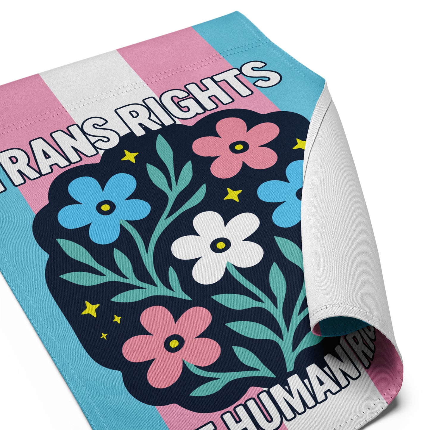 Close-up of Trans Rights Are Human Rights Flag with floral illustration and activist message