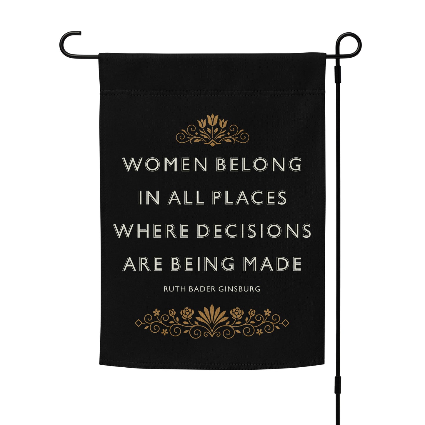 “Women Belong In All Places Where Decisions Are Being Made” progressive garden flag on a flag stand, featuring bold lettering and ornate gold decoration.