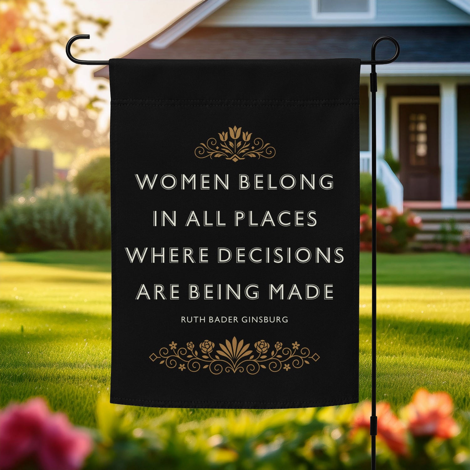 Progressive garden flag reading “Women Belong In All Places Where Decisions Are Being Made” shown outdoors on a flagpole in front of a home.