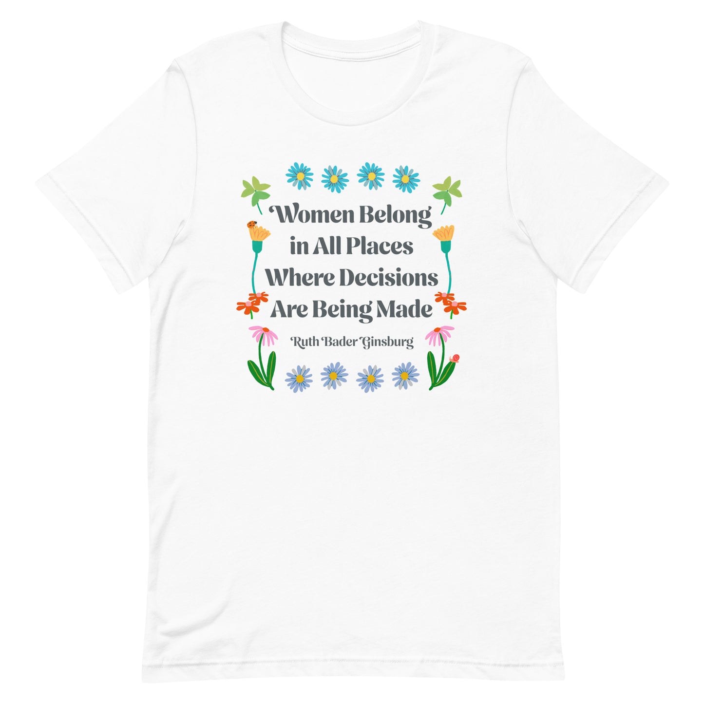 Flat lay of white unisex t-shirt showing detailed floral border and Ruth Bader Ginsburg quote “Women Belong In All Places Where Decisions Are Being Made,” by Blue Wave USA.