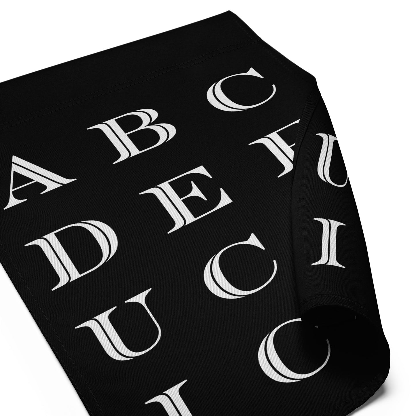 Folded garden flag featuring bold alphabet typography in white on black background, vertical banner format, minimalist graphic style, printed message “ABCDEFUCKICE.”