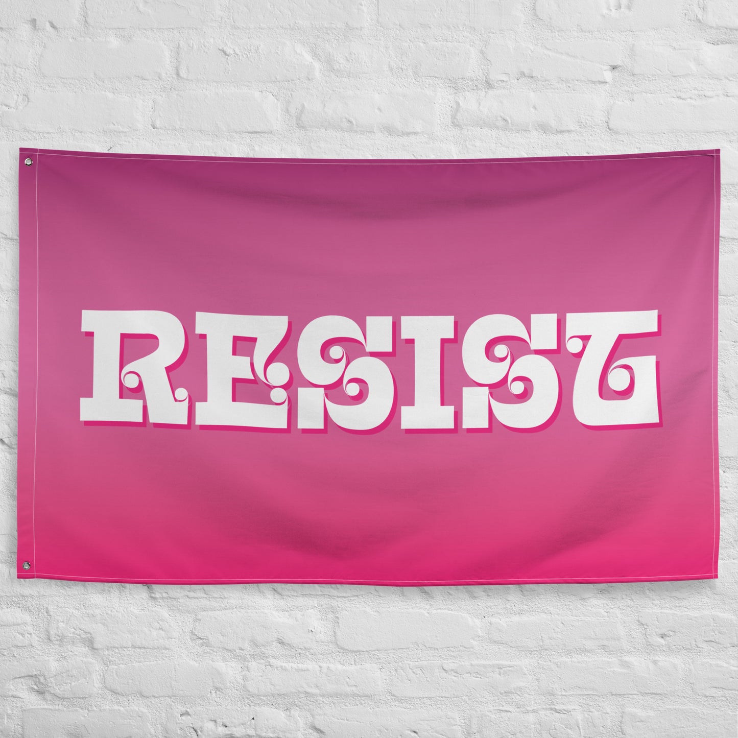 Front View Image: Bold RESIST Best Pink Feminist Flag waving against a clear sky.