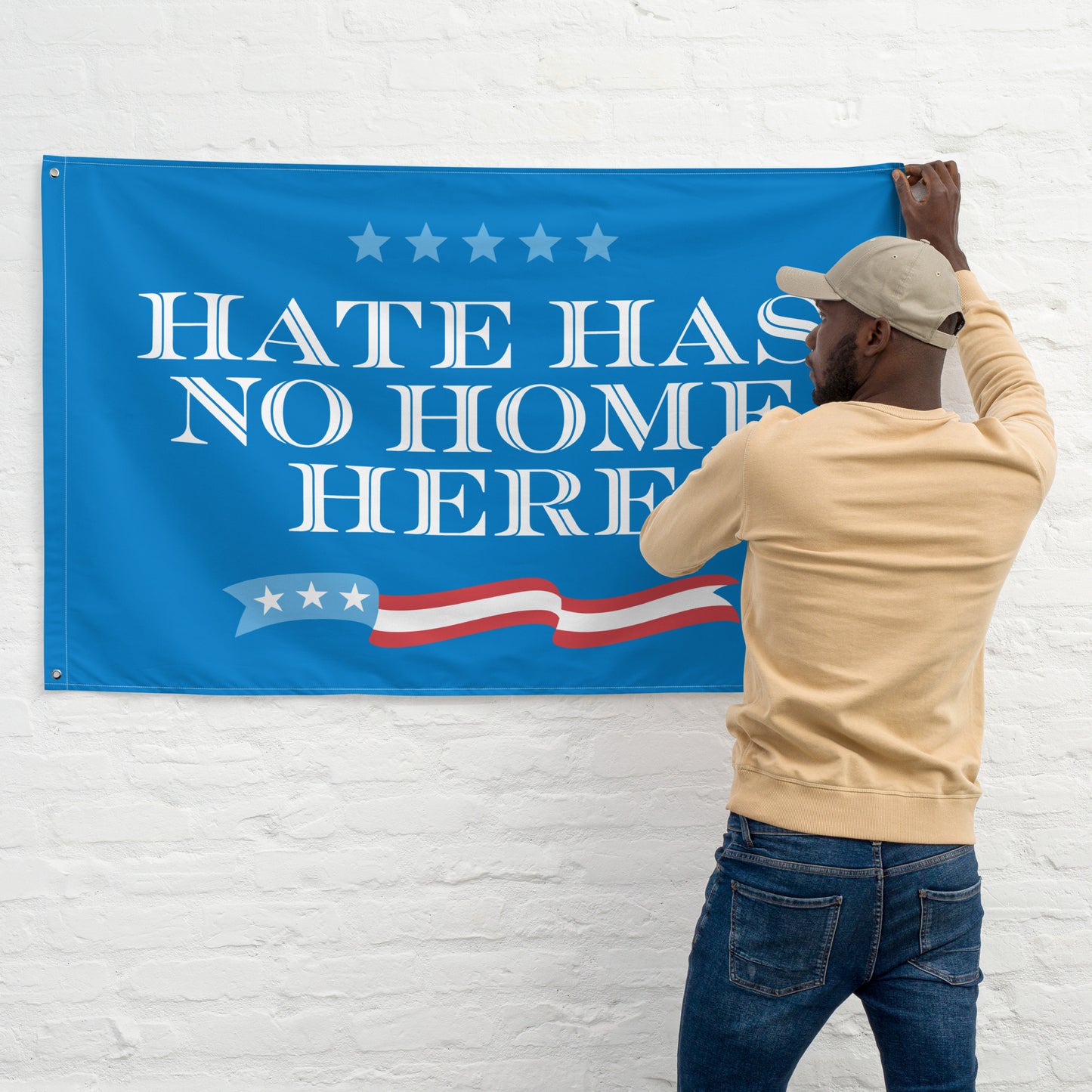 Bold Hate Has No Home Here flag displayed on a wall.
