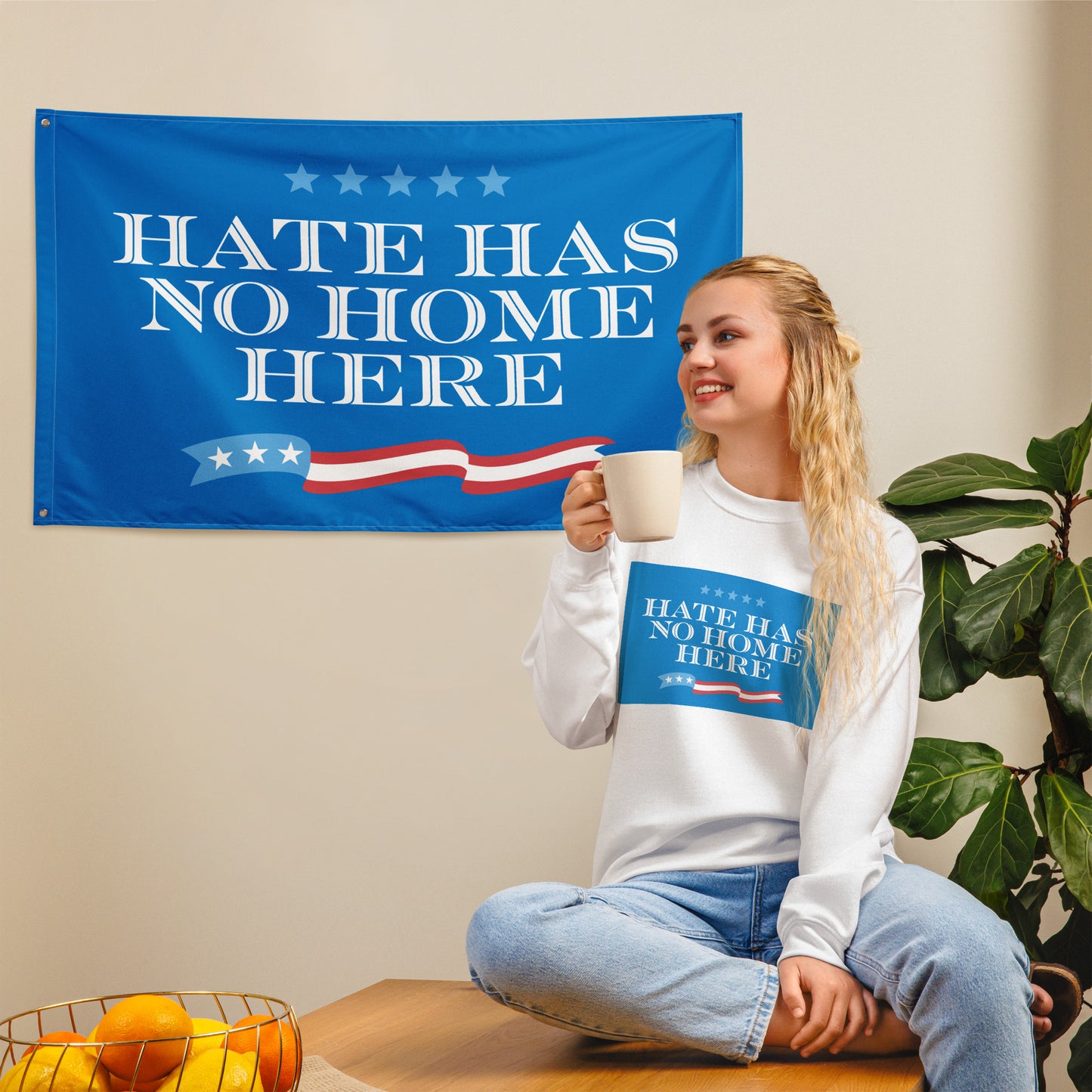 Bold Hate Has No Home Here flag displayed on a wall.