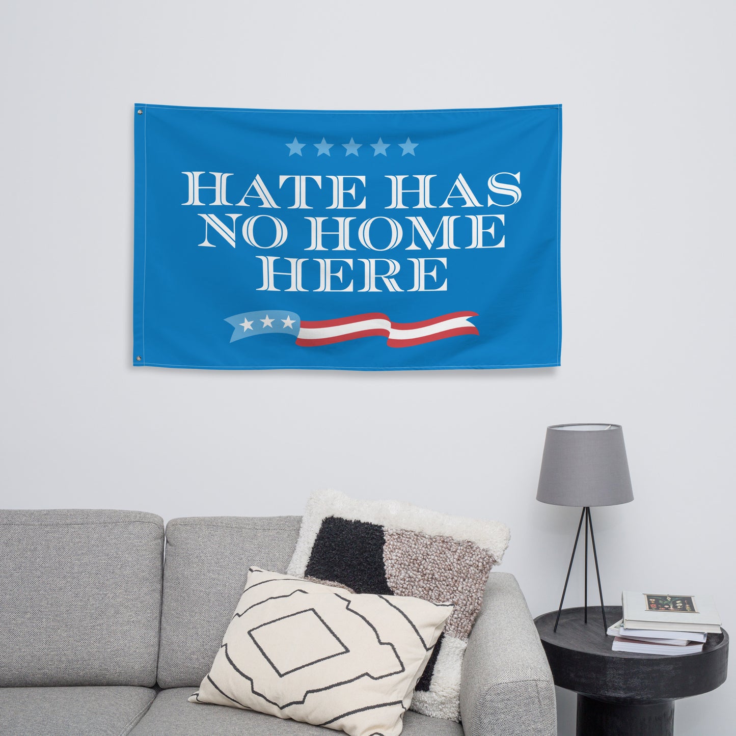 Bold Hate Has No Home Here flag displayed on a wall.