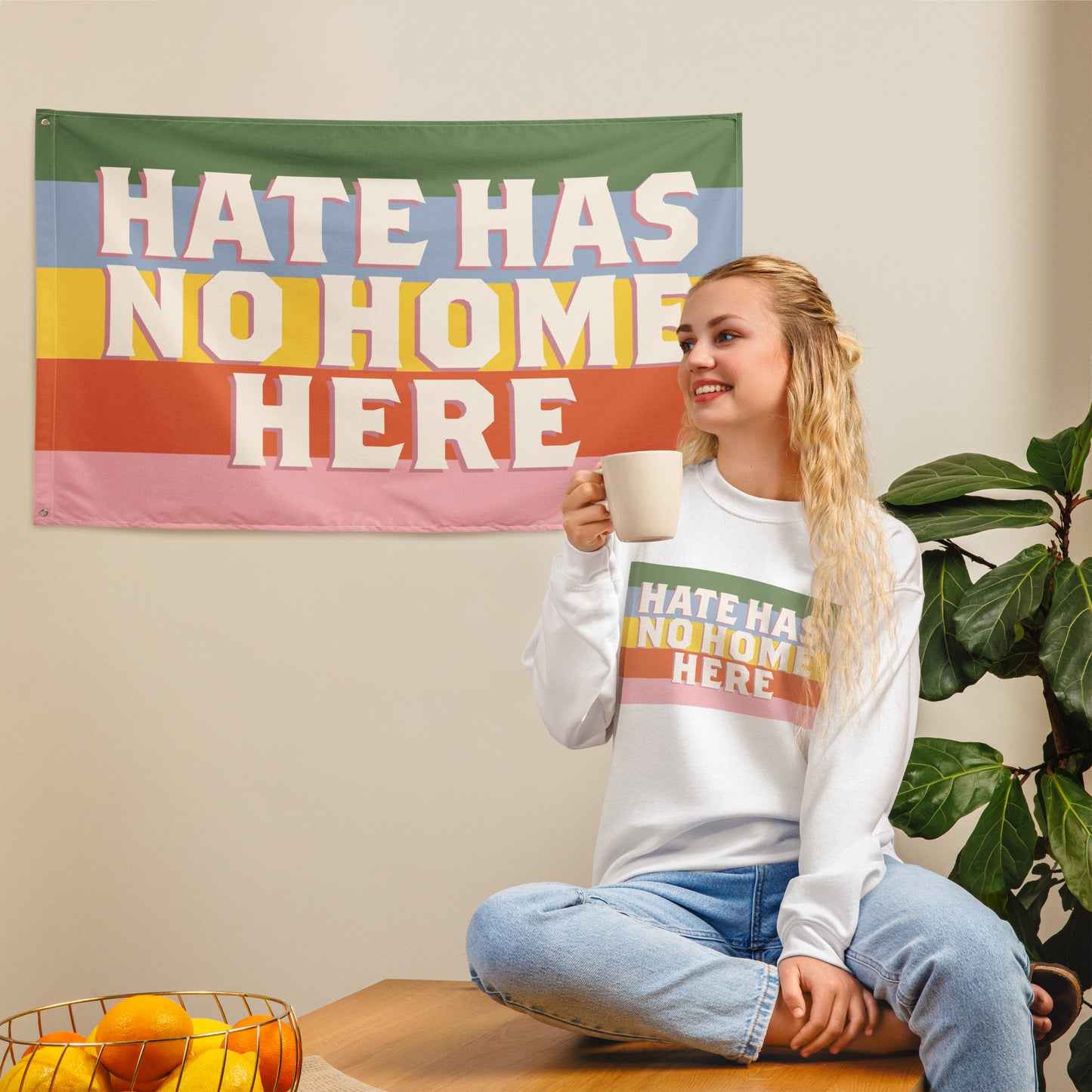 Front View Image: Equality-focused flag with bold Hate Has No Home Here lettering.