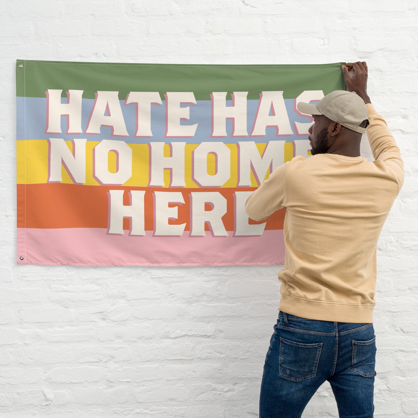 Front View Image: Equality-focused flag with bold Hate Has No Home Here lettering.