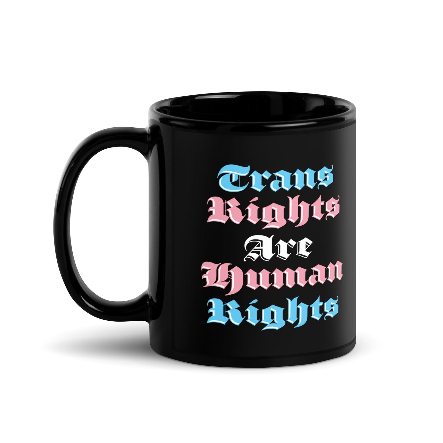 Front view of the 11 oz Trans Rights Are Human Rights Black Mug on a table