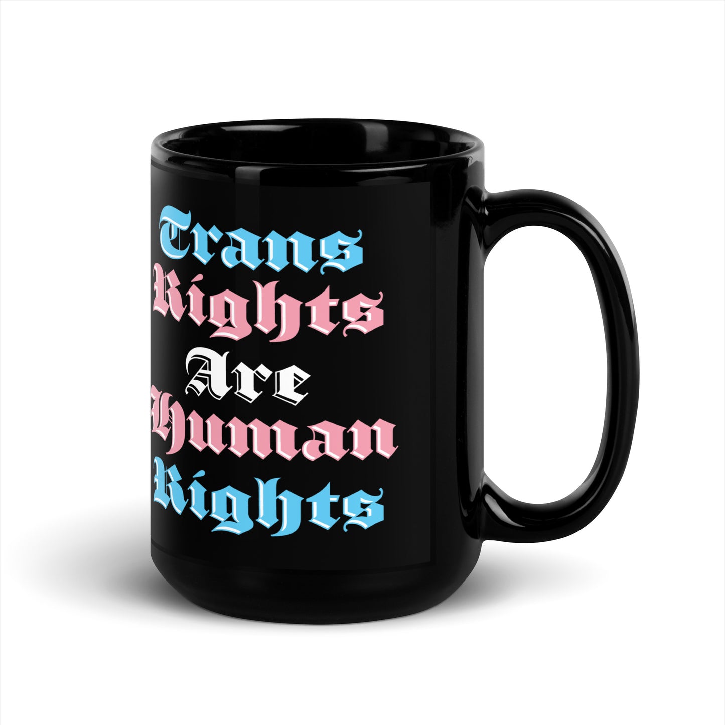 Front view of the 15 oz Trans Rights Are Human Rights Black Mug on a table