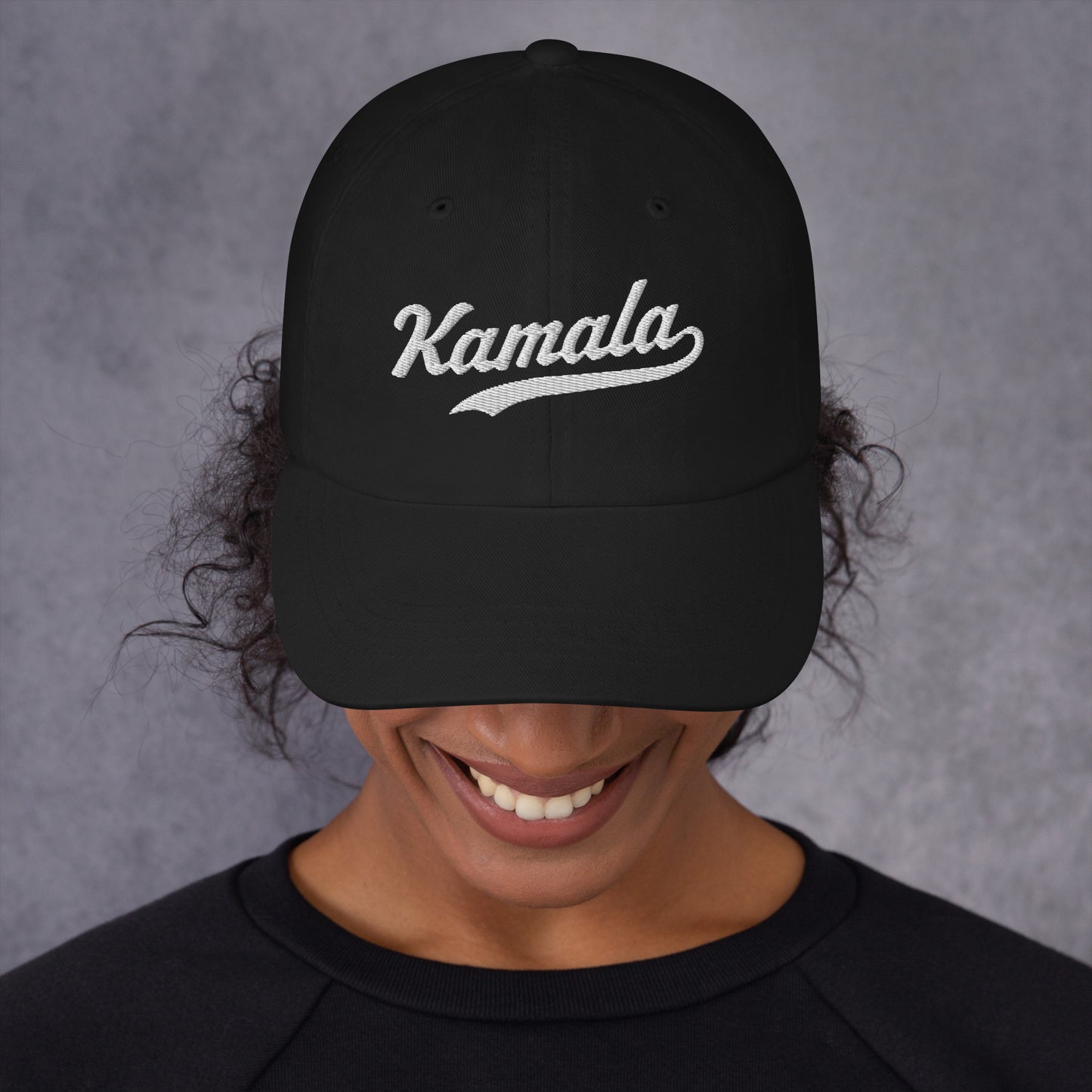 Detail view of the Kamala dad hat features Kamala Harris's iconic name in classic embroidered script