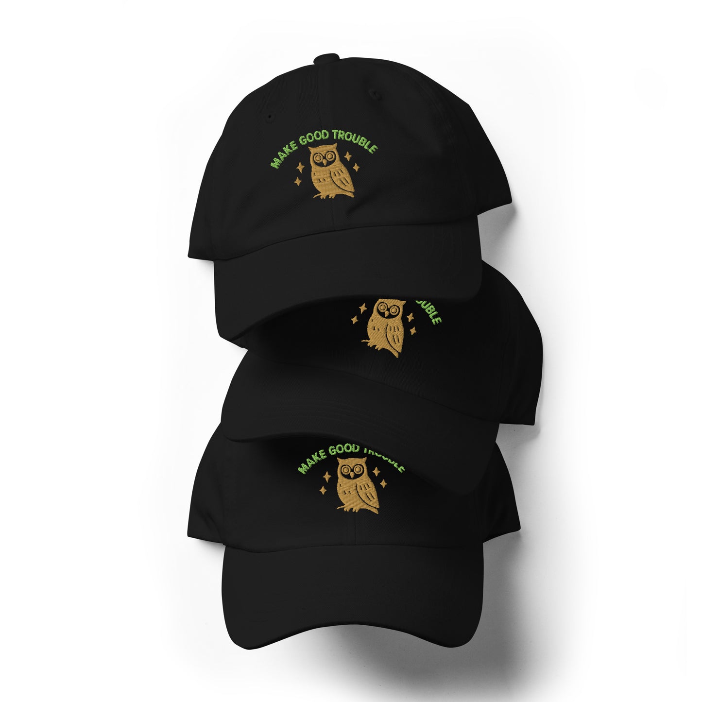 Stack of Make Good Trouble hat featuring owl and embroidered civil rights message