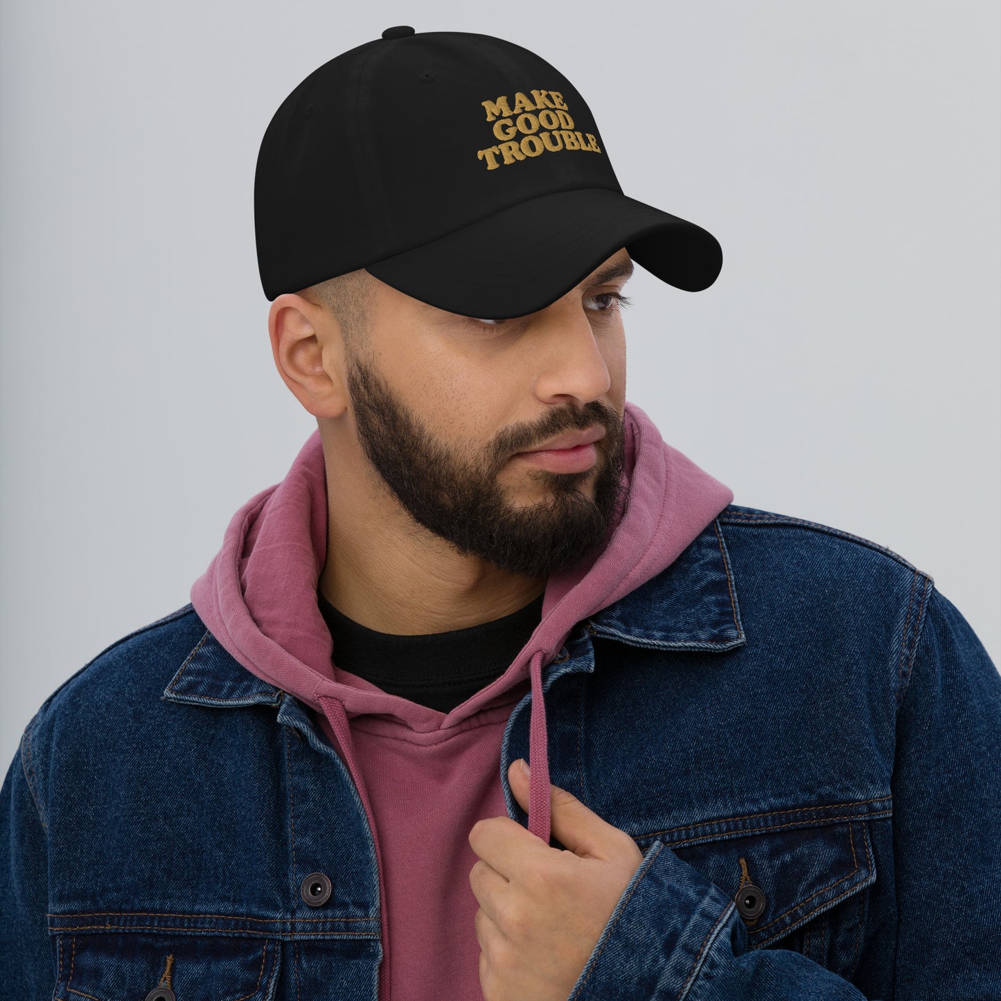 Lifestyle Image: Male protester wearing Make Good Trouble hat