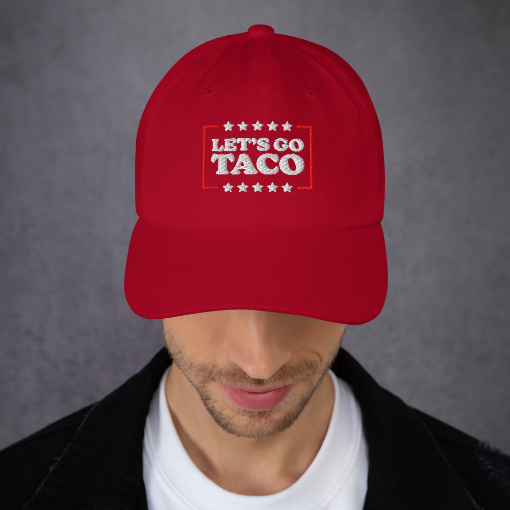 Lifestyle Image: Model wearing Let’s Go T.A.C.O. Anti-Trump Dad Hat