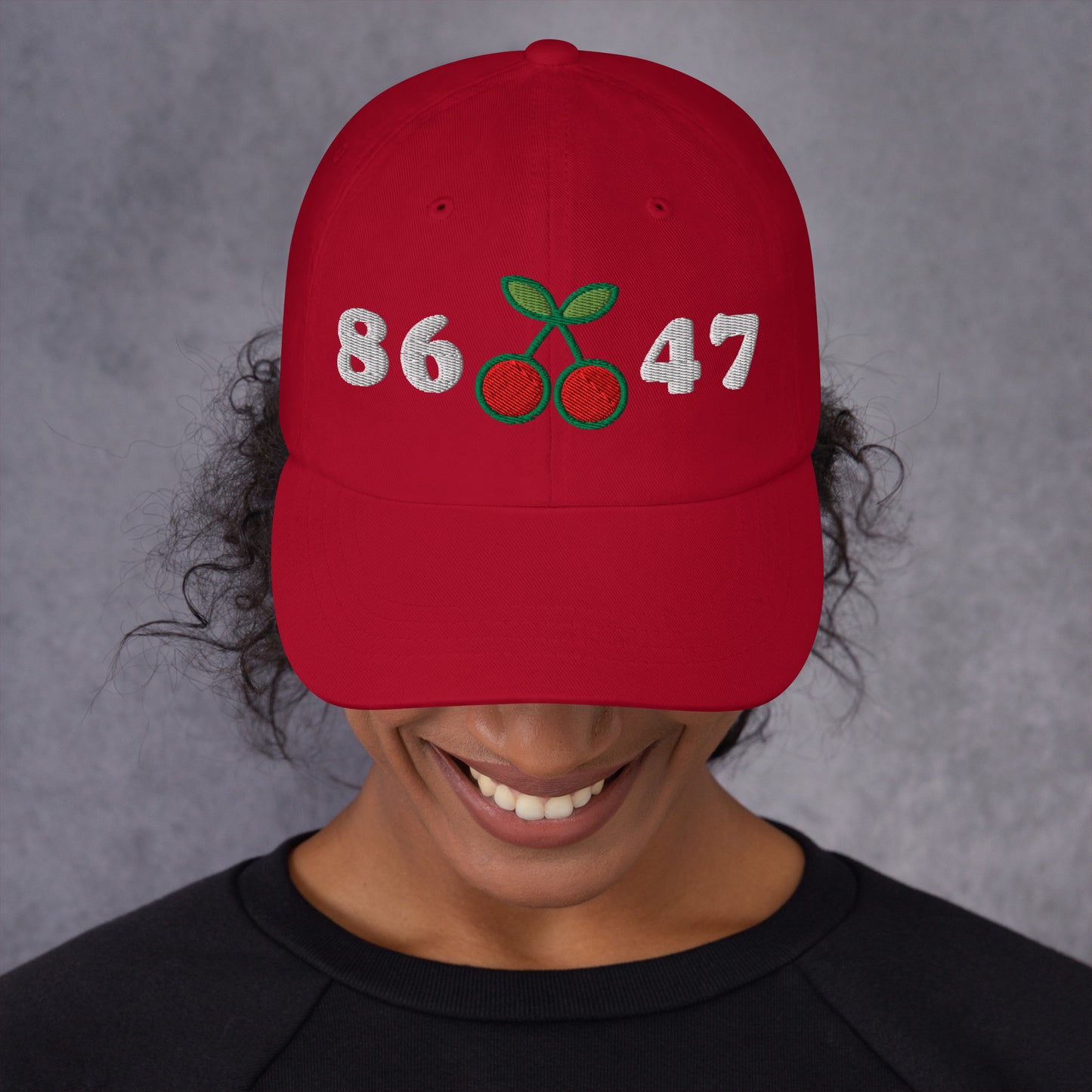 Lifestyle Image: Woman activist Wearing 8647 Anti-Trump Cherry Hat