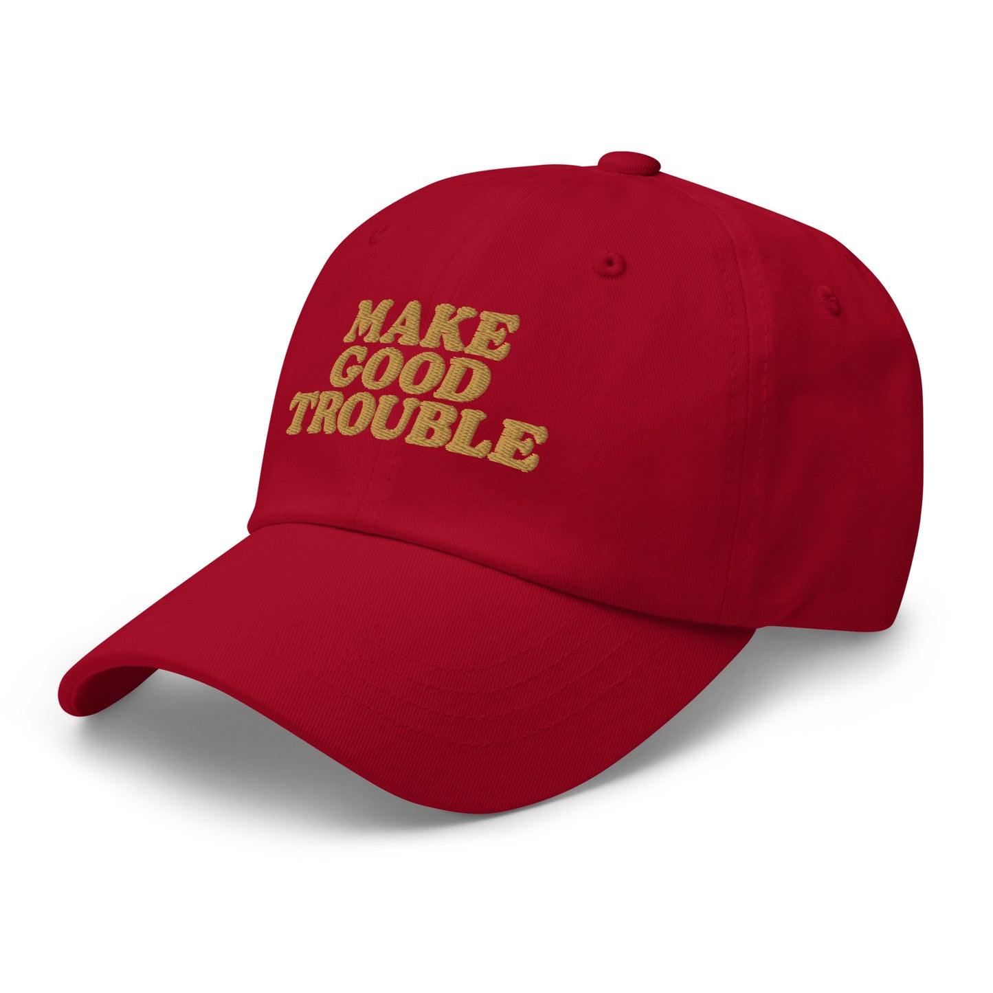 Side Front View Image: Side Front view of dad hat with bold “Make Good Trouble” gold embroidery - cranberry red