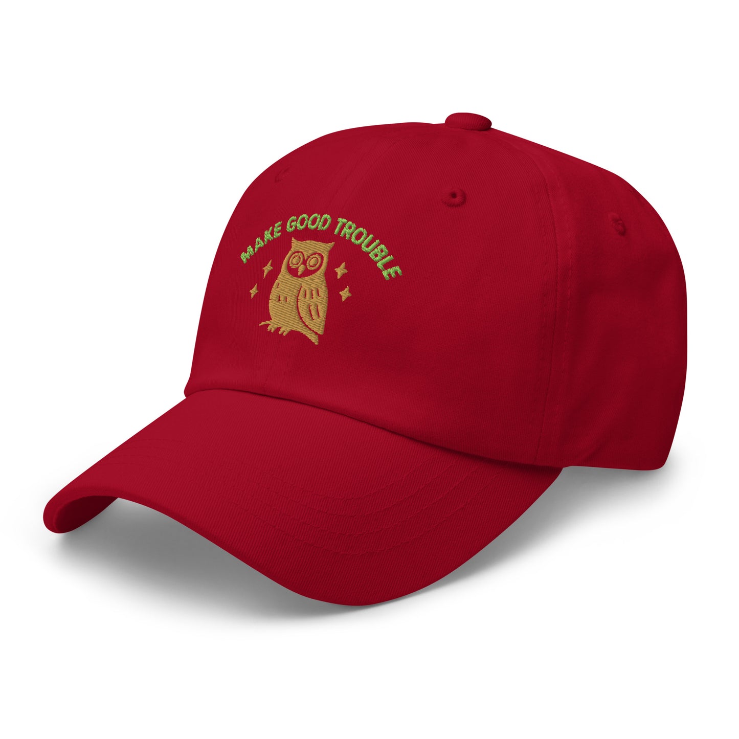 Side Front view of embroidered dad hat with “Make Good Trouble” text and golden owl