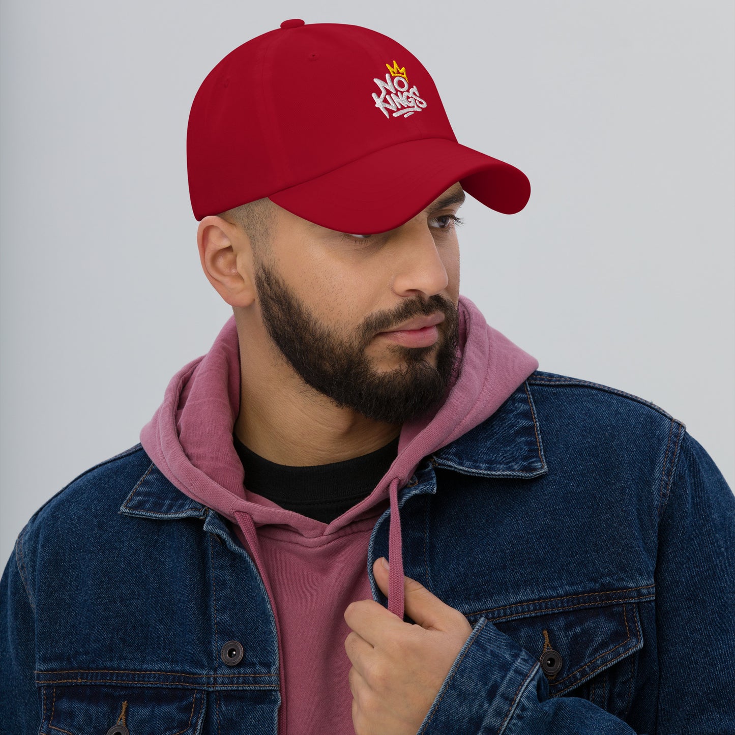 Lifestyle Image: Person wearing No Kings Anti-Trump, anti-authoritarian dad hat
