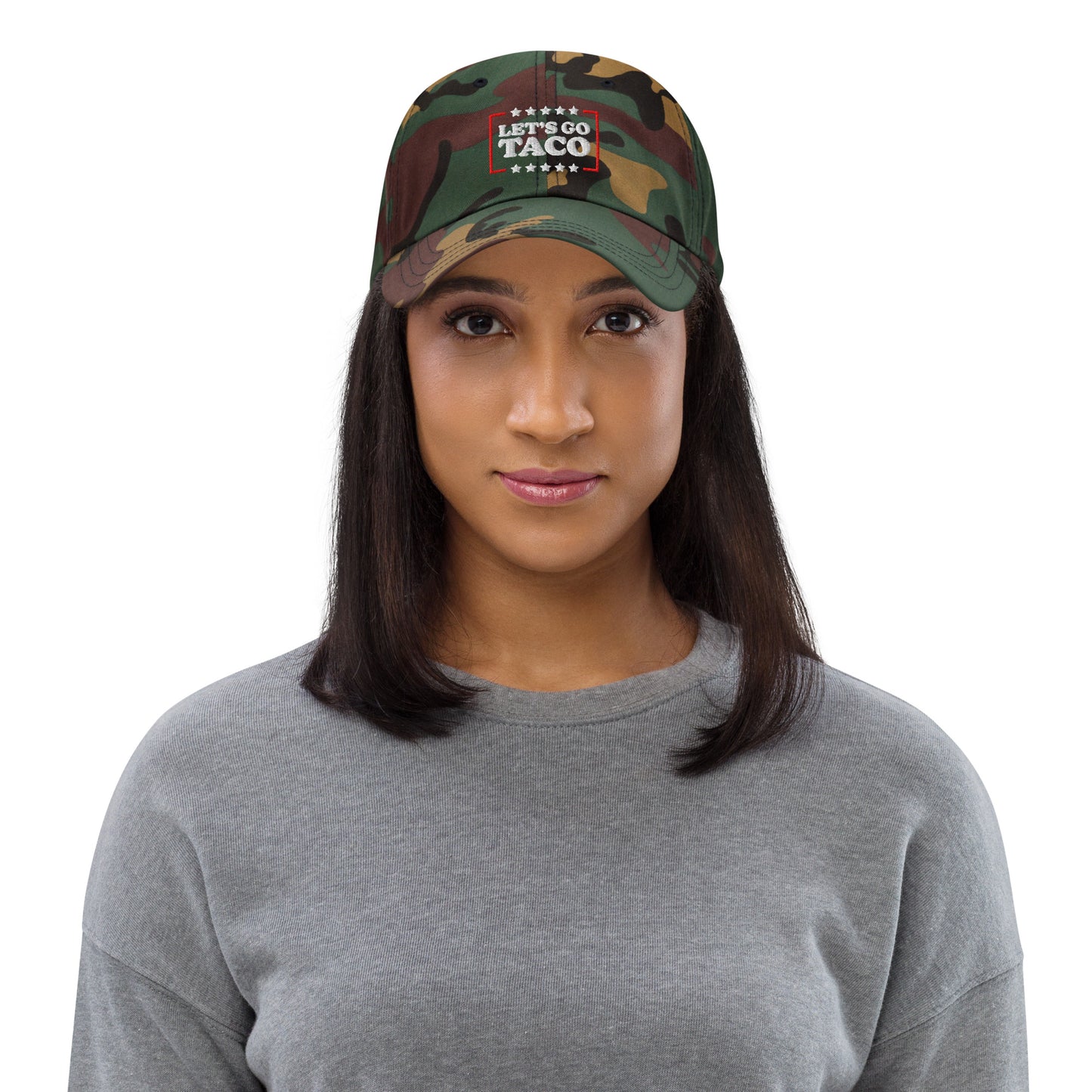 Lifestyle Image: Woman wearing Let’s Go T.A.C.O. Anti-Trump Camo Dad Hat