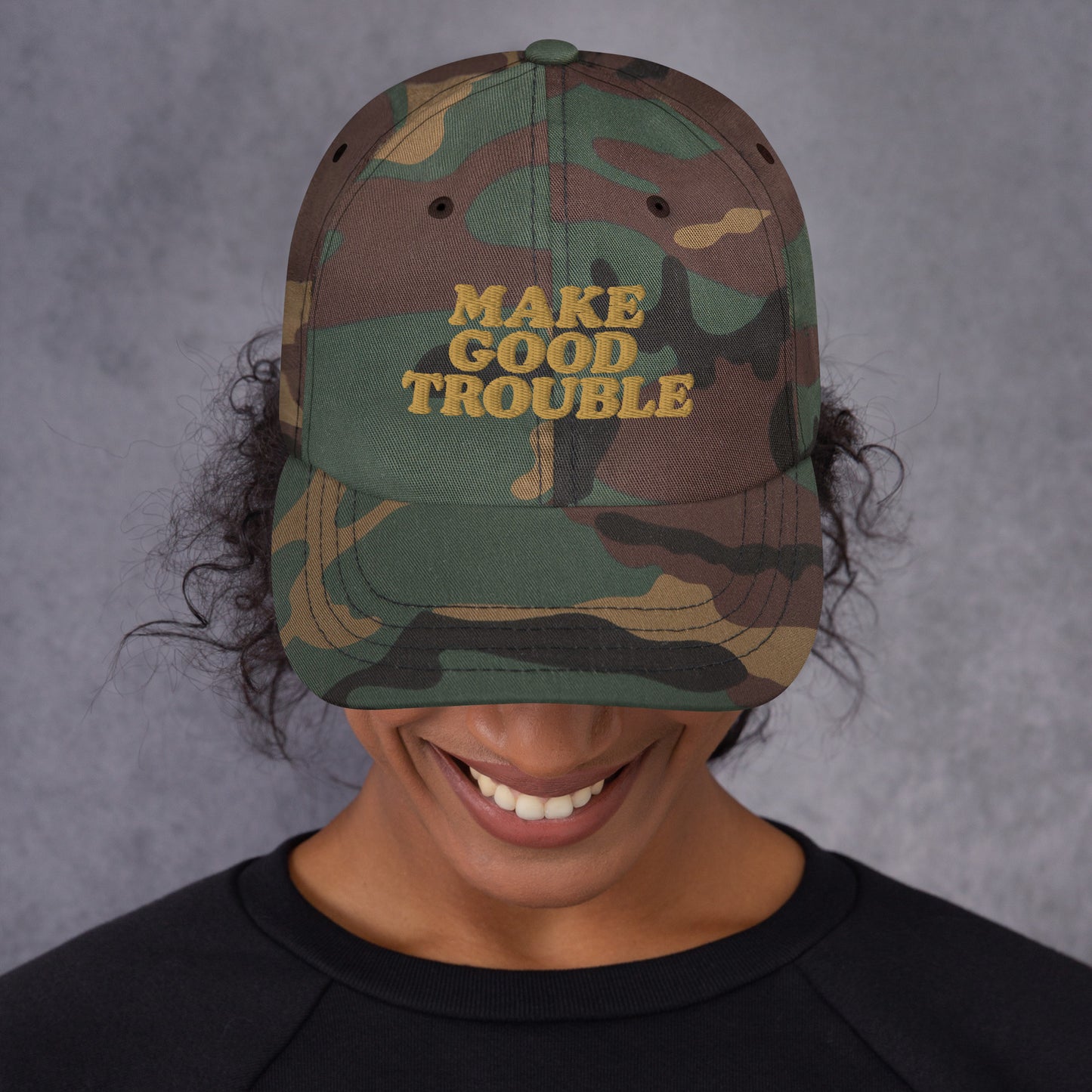 Close up Lifestyle Image: Female protester wearing Make Good Trouble hat