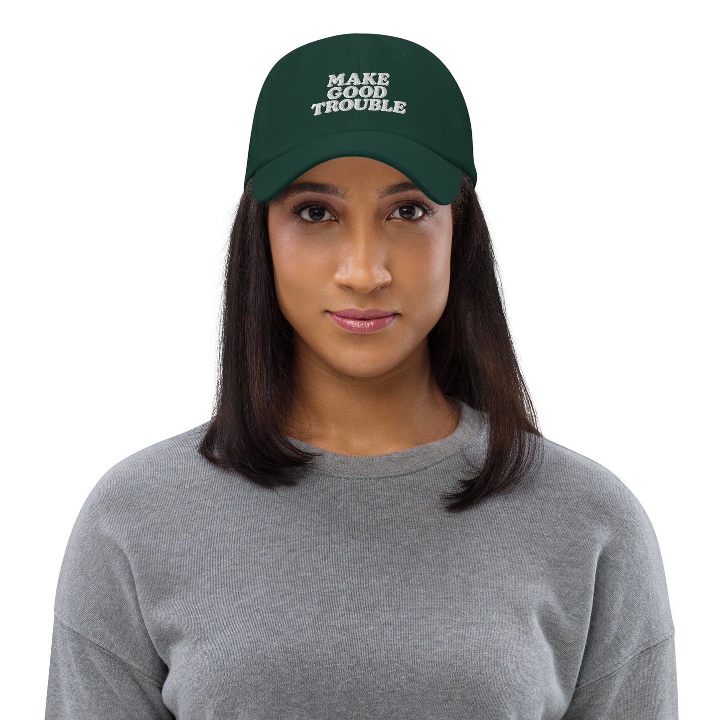 Female activist wearing the John Lewis "Make Good Trouble" Quote Social Justice Dad Hat