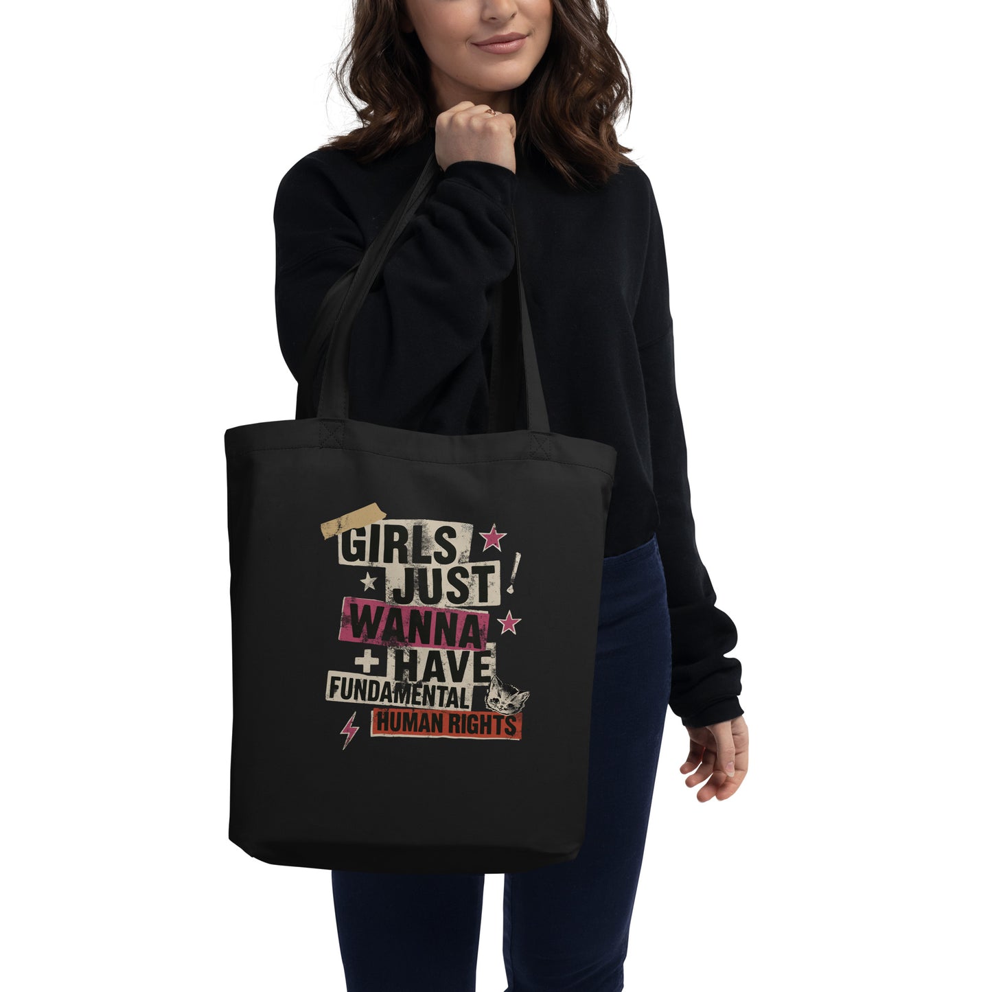 Model carrying the black eco tote with “Girls Just Wanna Have Fundamental Human Rights” punk collage design. Edgy, progressive feminist statement bag by Blue Wave USA.