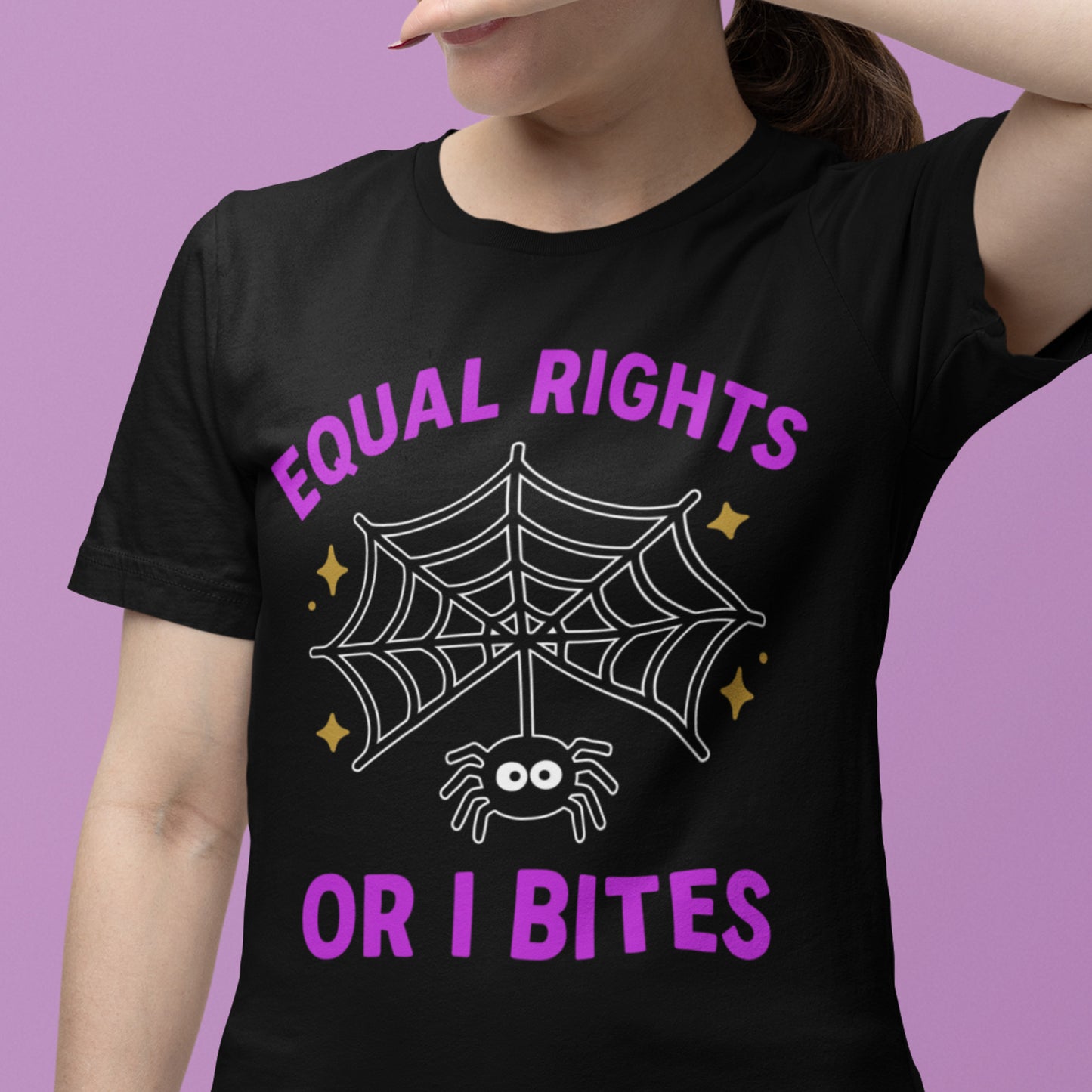Person smiling in “Equal Rights or I Bites” spider web tee, Blue Wave USA progressive apparel for feminist activists.