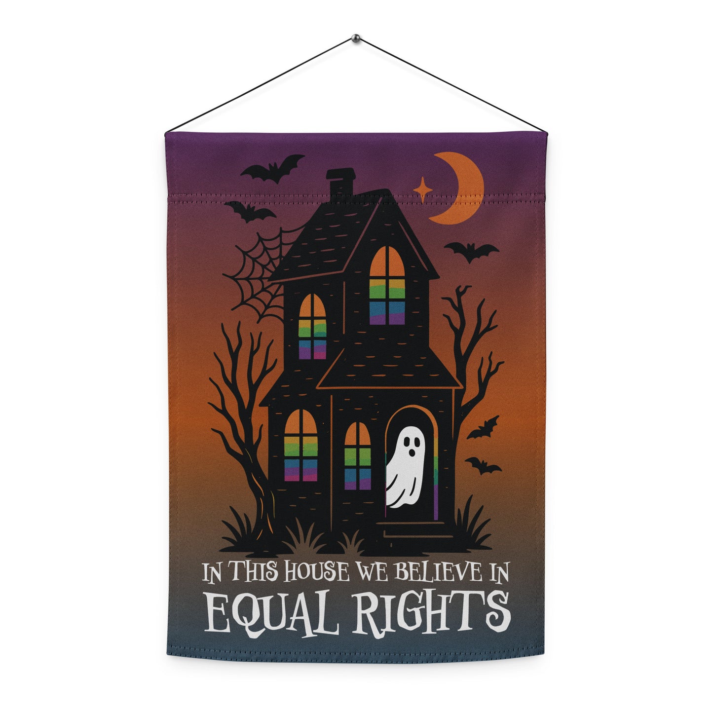 Front view of the “In This House We Believe in Equal Rights” Halloween garden flag with ghost, bats, and rainbow-colored windows.