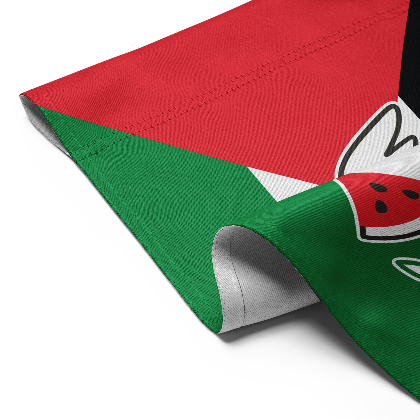 Detailed folded view of the Free Palestine solidarity garden flag with red, white, green, and black colors, and dove holding olive branch.