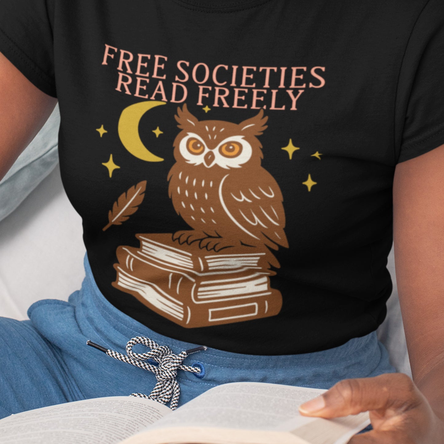 Model wearing “Free Societies Read Freely” owl t-shirt, progressive apparel by Blue Wave USA promoting banned books awareness.
