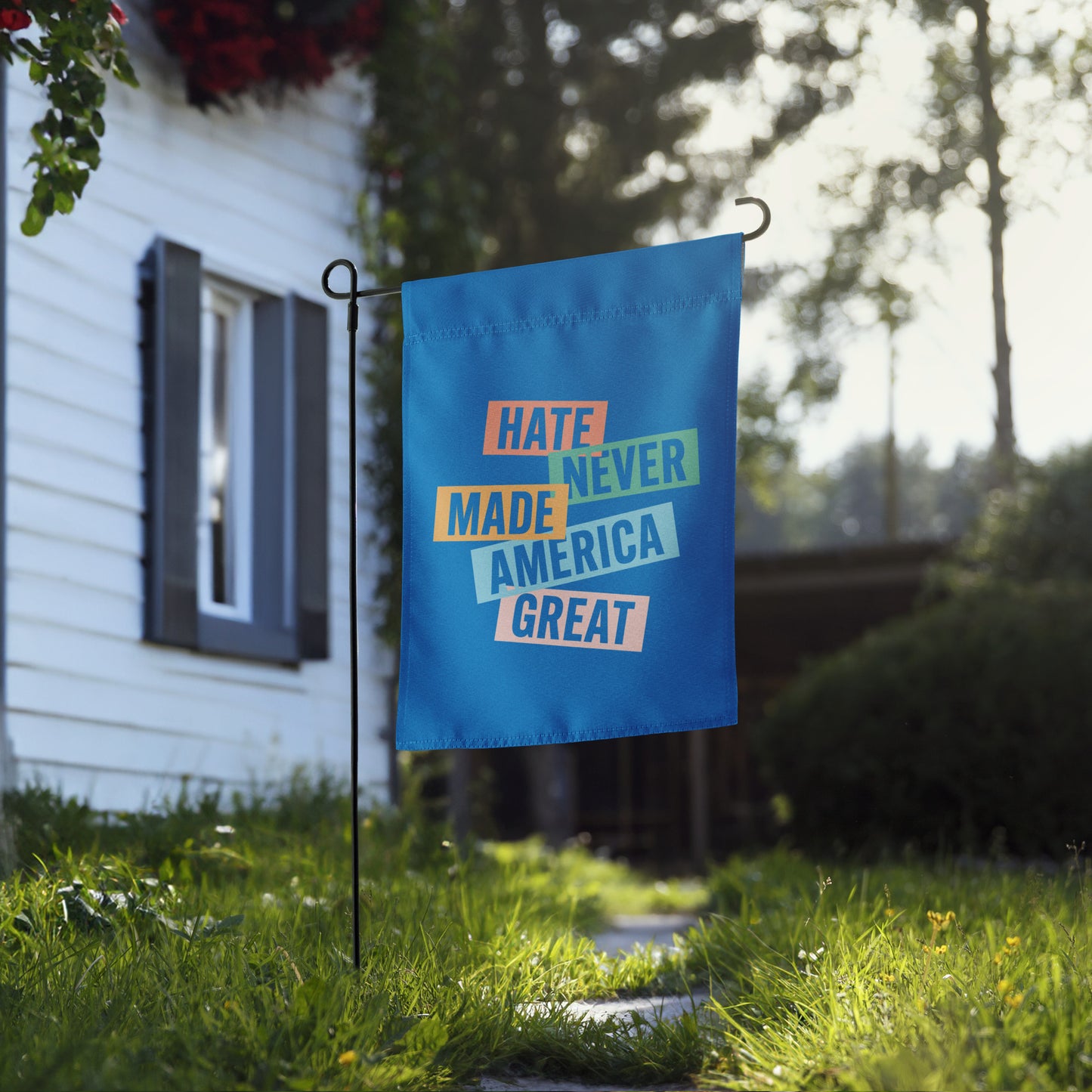 Front View Image: Full display of the progressive garden flag in a vibrant yard