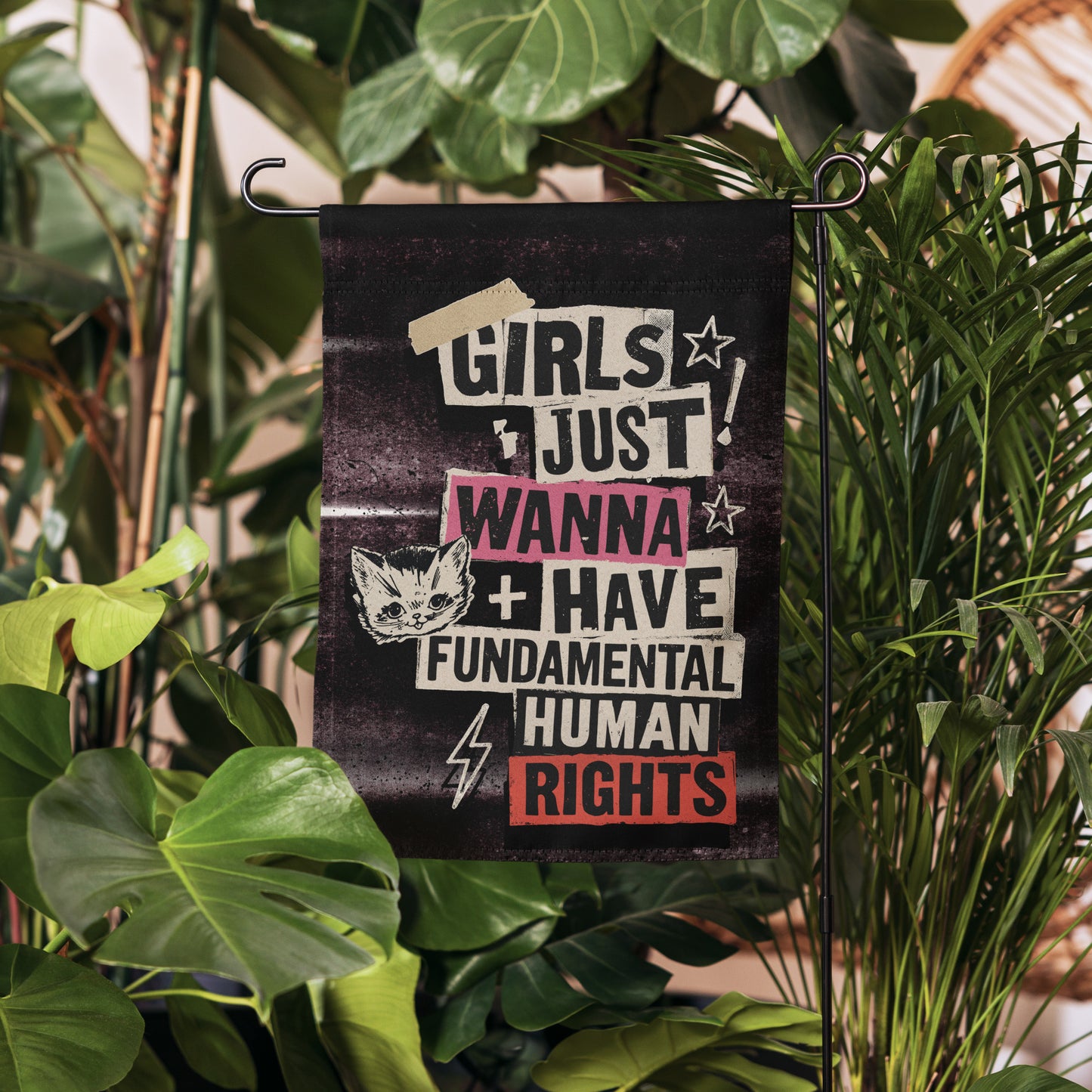 Lifestyle Image: Garden setting with Girls Just Wanna Have Fundamental Human Rights Punk Flag proudly displayed outdoors