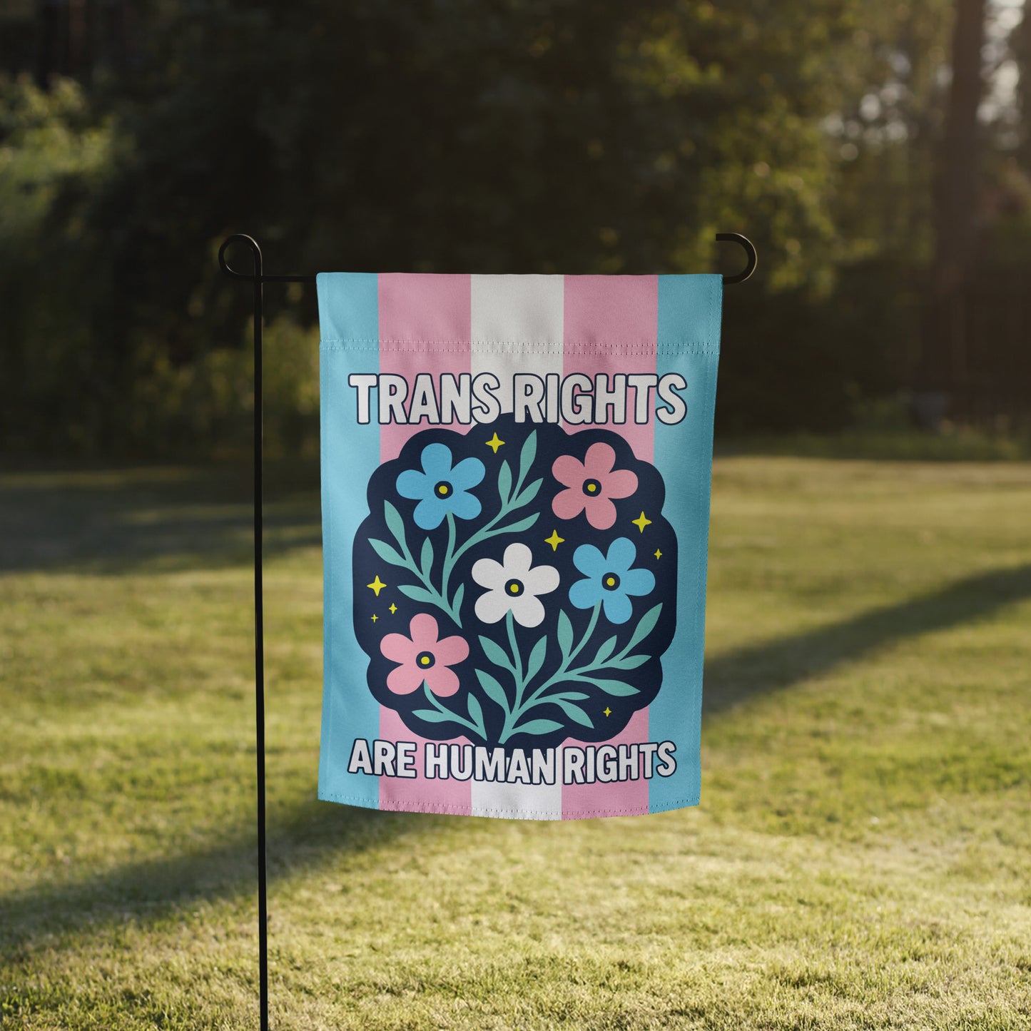 Front View Image: Trans Rights Are Human Rights Garden Flag displayed on outdoor stand