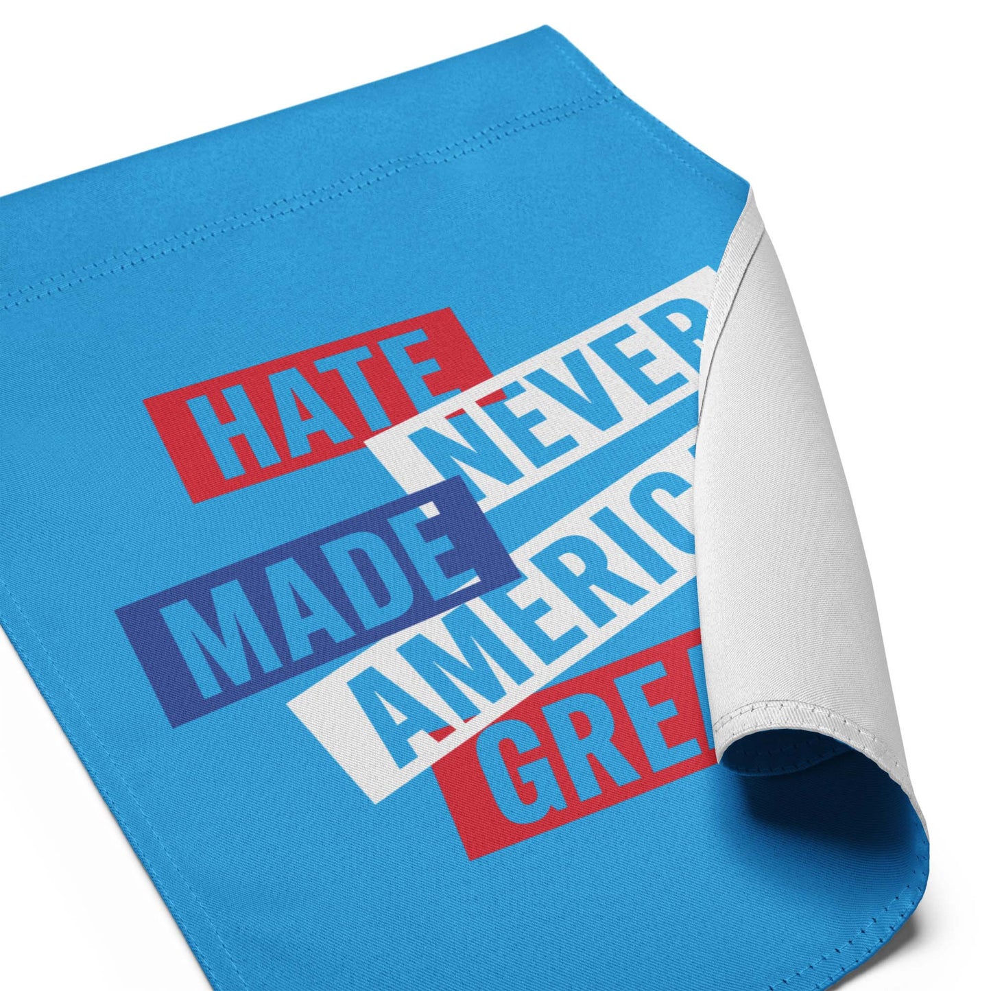 Detail View Image: Full display of the Hate Never Made America Great garden flag in a white background.