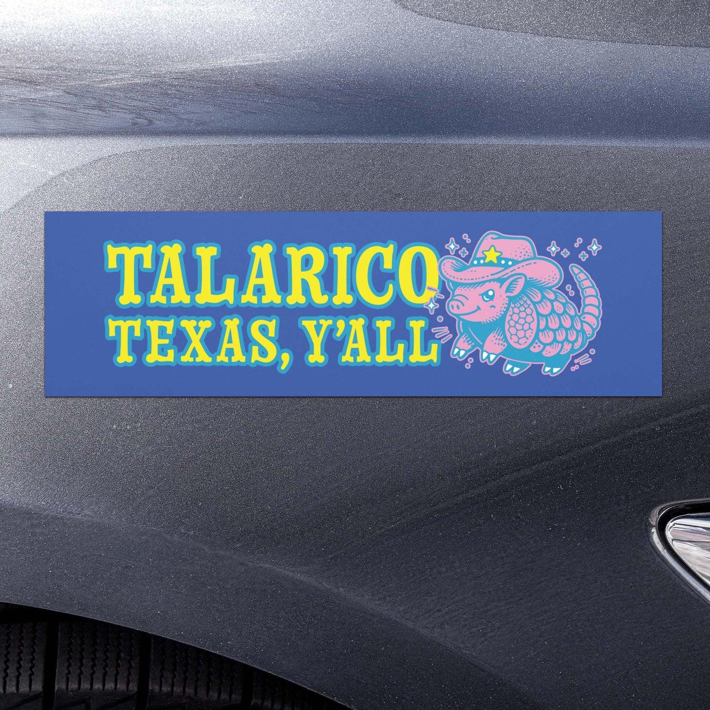 Blue car magnet applied to vehicle showing retro “Talarico Texas Y’all” lettering and stylized armadillo graphic in western-inspired political design.