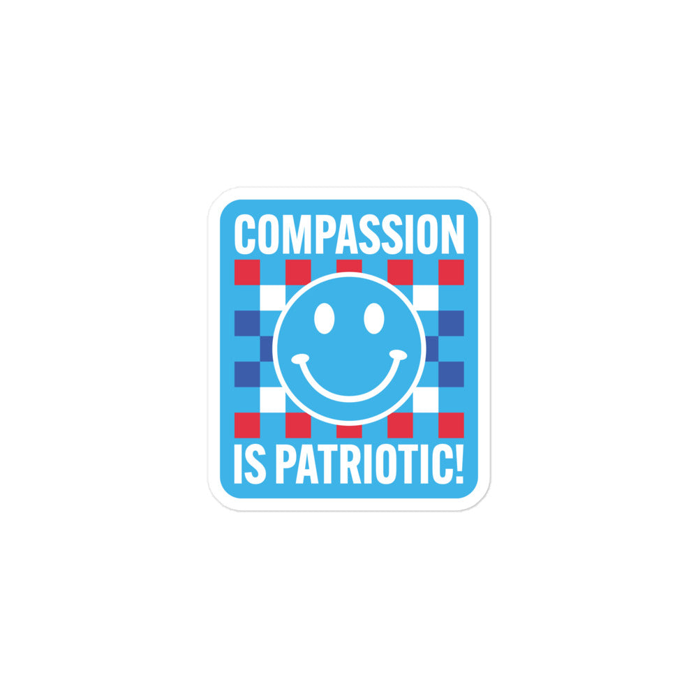 Front view of the Compassion Is Patriotic Patriotic Kindness Social Awareness Sticker featuring a bold red, white, and blue design.