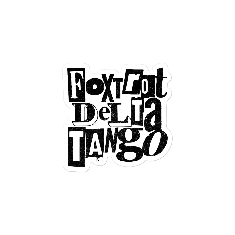 Grunge-style vinyl sticker featuring the "Foxtrot Delta Tango" anti-Trump message in a distressed design.