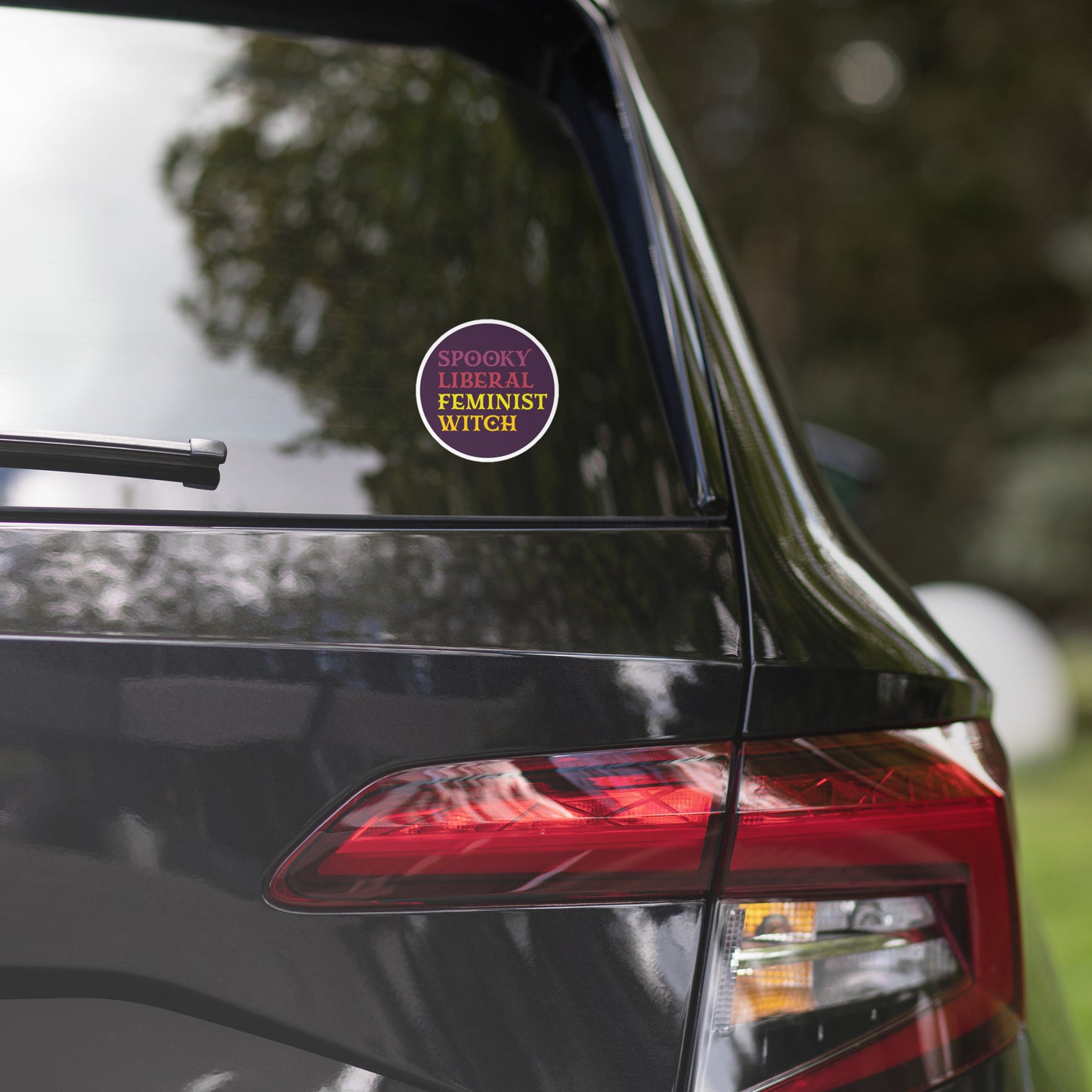 Front View Image: Feminist witch vinyl sticker with bold spooky design.