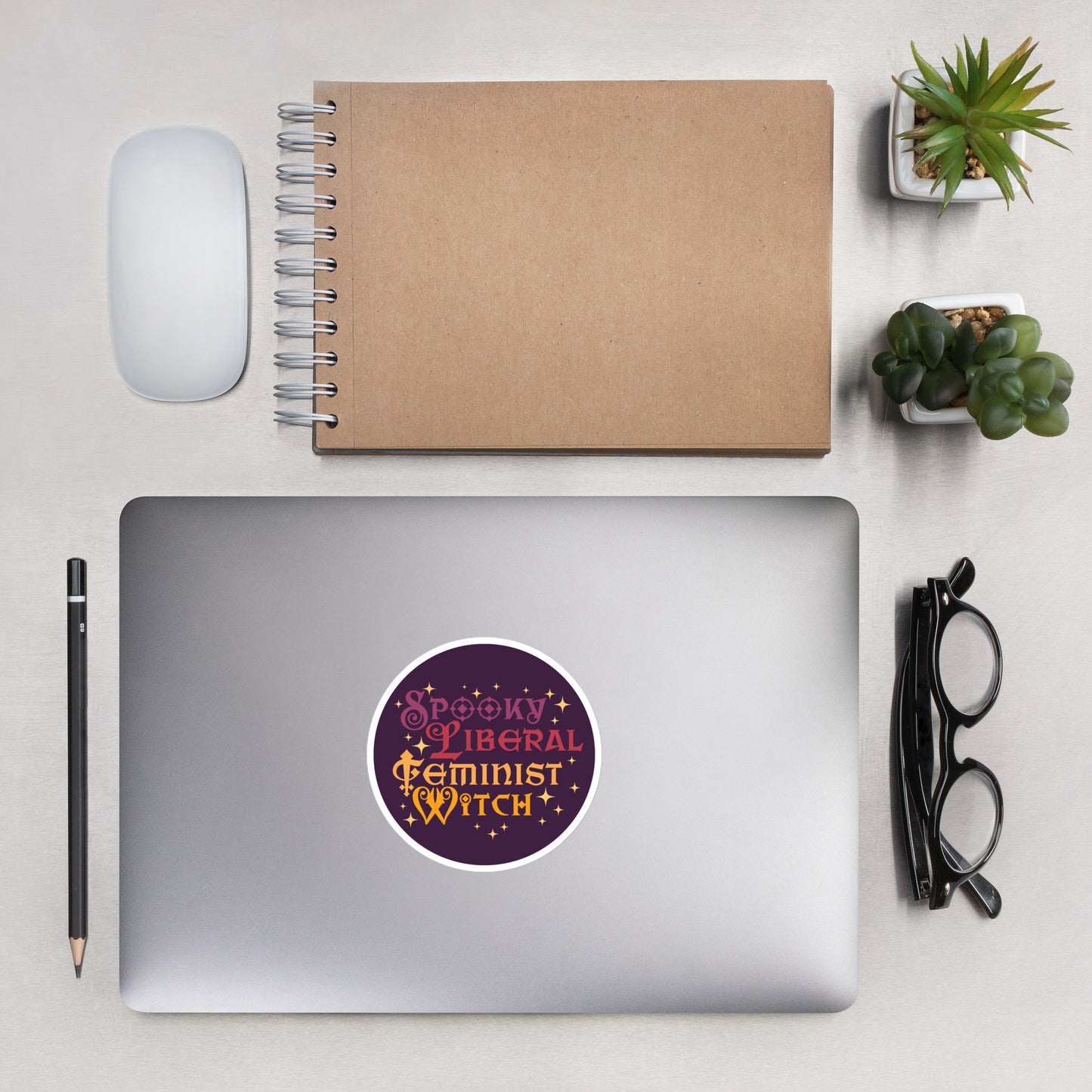 Front View Image: Spooky Liberal Feminist Witch Vinyl Sticker with bold witchy design