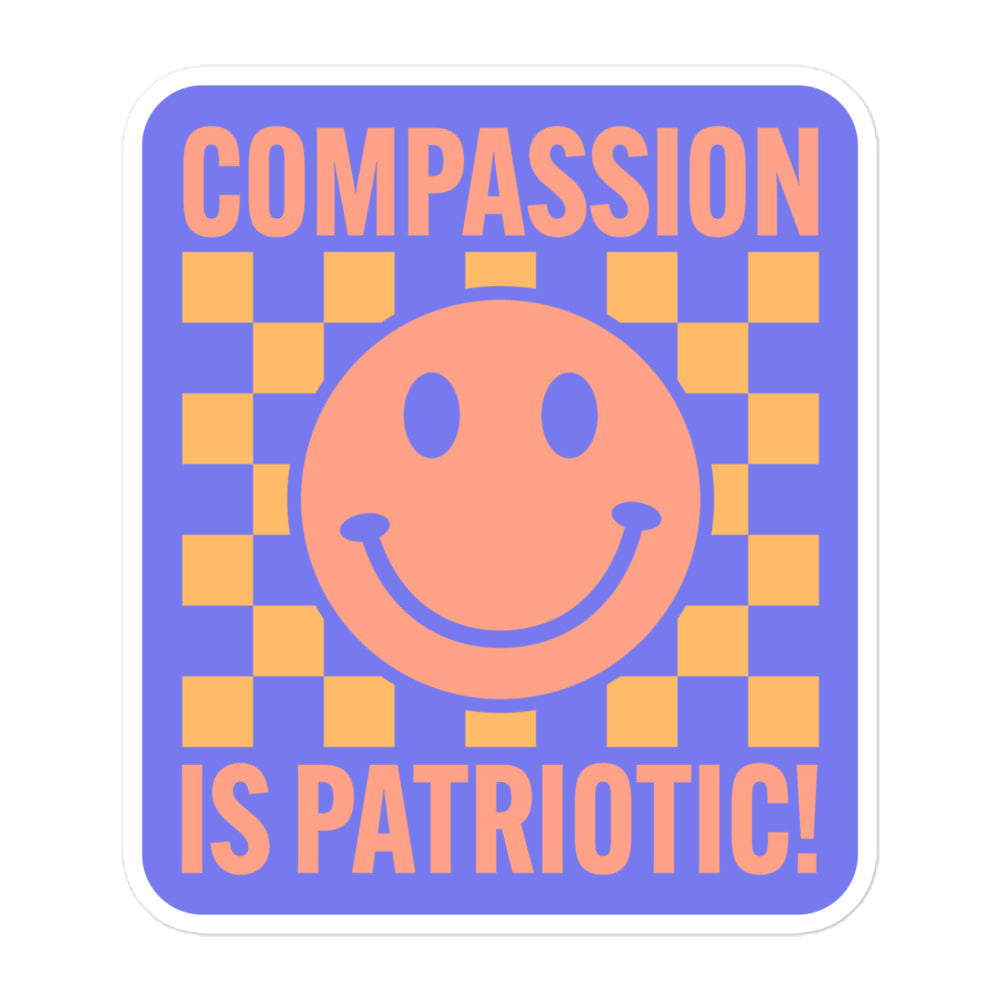 Close-up of the smiley face and text Compassion Is Patriotic on the sticker.