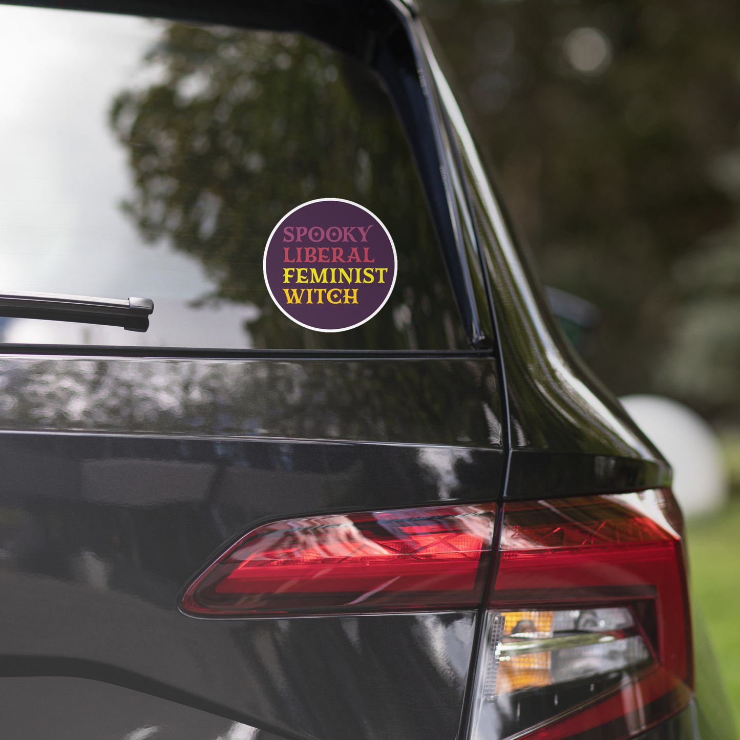 Front View Image: Feminist witch vinyl sticker with bold spooky design.