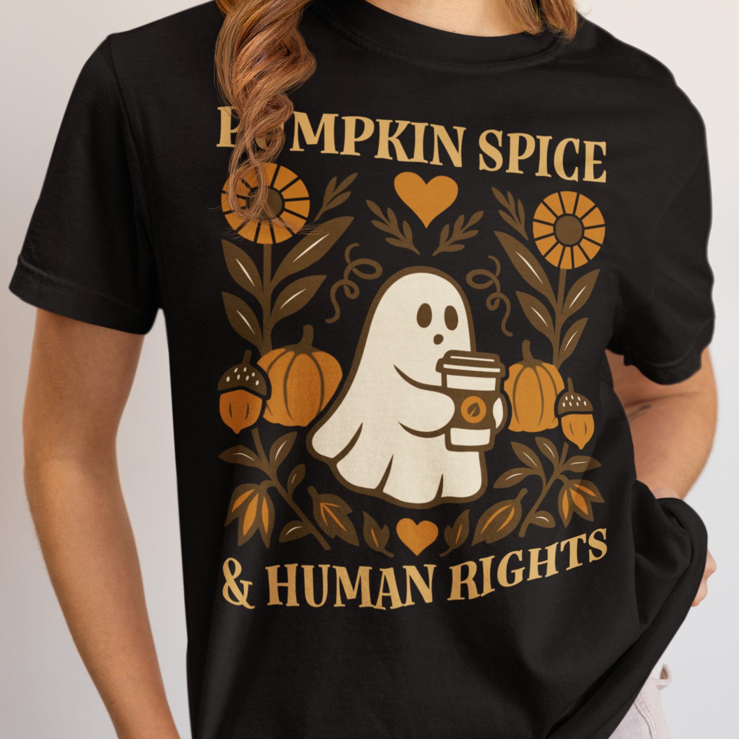 Model wearing “Pumpkin Spice & Human Rights” graphic tee with pumpkin and floral artwork, Blue Wave USA progressive fall fashion.
