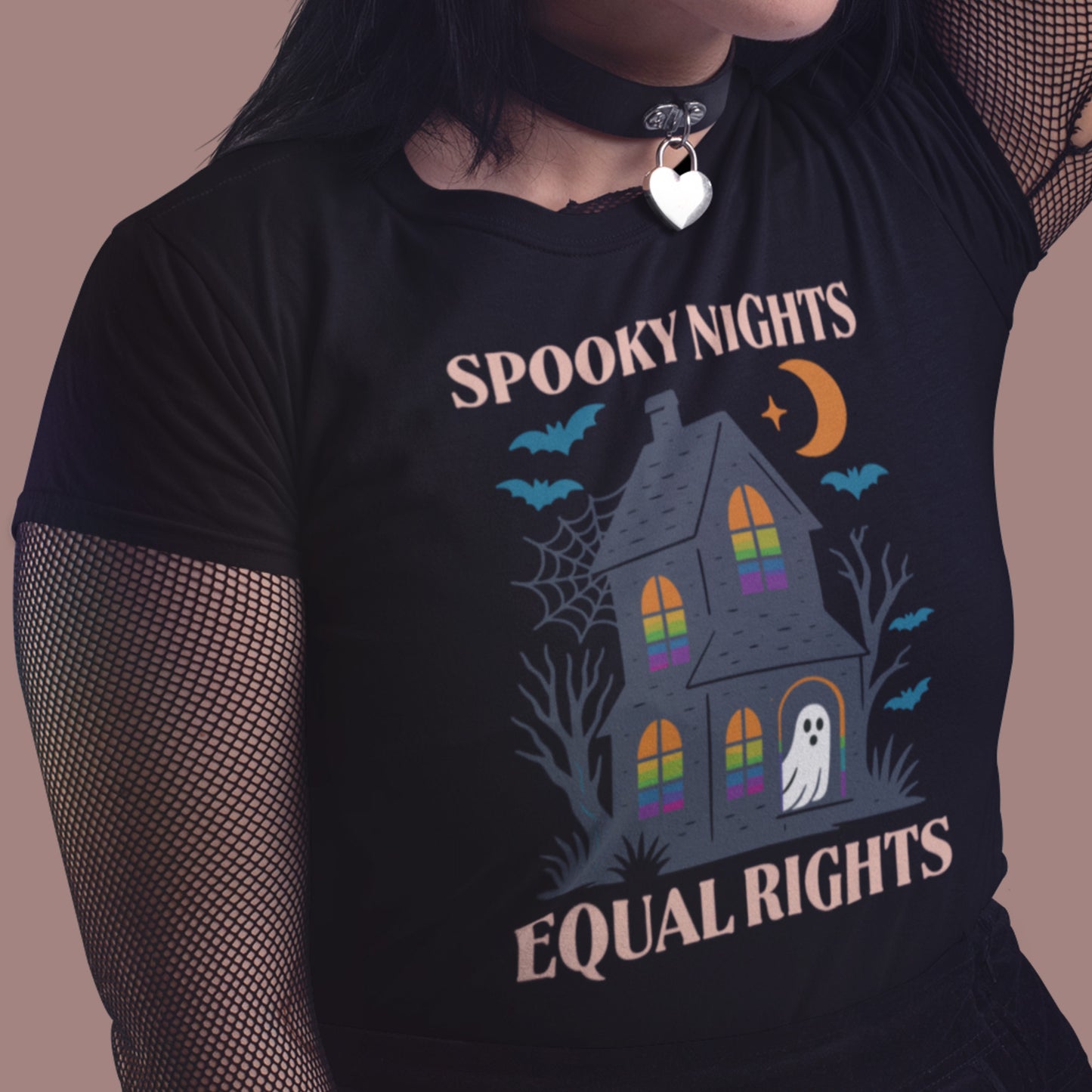 Model wearing “Spooky Nights, Equal Rights” Halloween shirt with haunted house and ghost, Blue Wave USA progressive apparel for spooky season.