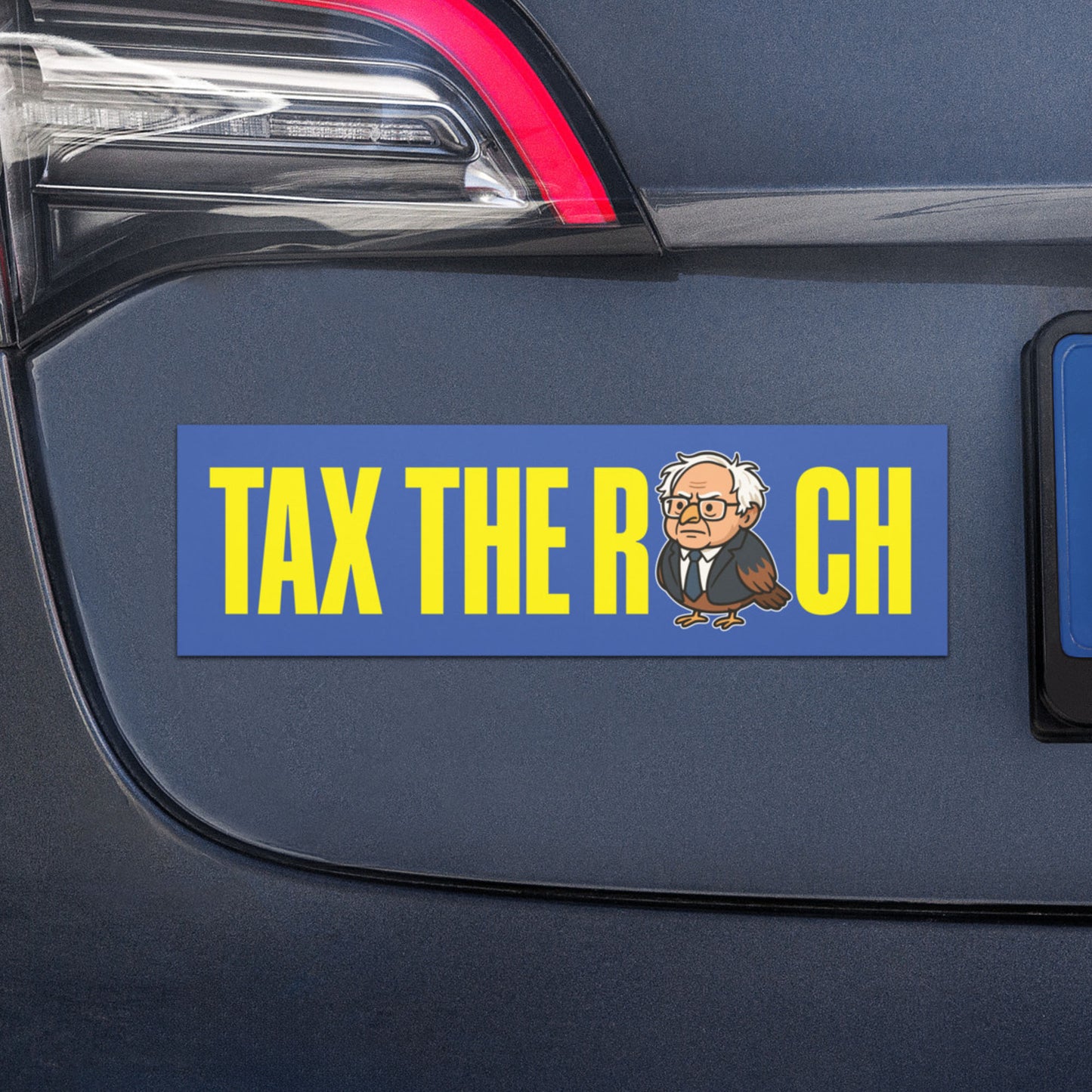 Blue Wave USA car magnet mockup displayed on vehicle, showing “TAX THE RICH” wording with Birdie Sanders bird pun artwork.