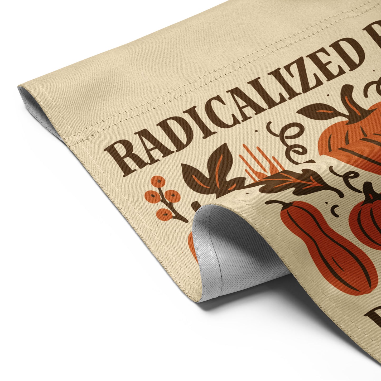Detailed folded corner view of the “Radicalized By Basic Decency” fall garden flag with rustic pumpkin and foliage illustrations, Blue Wave USA activist décor.