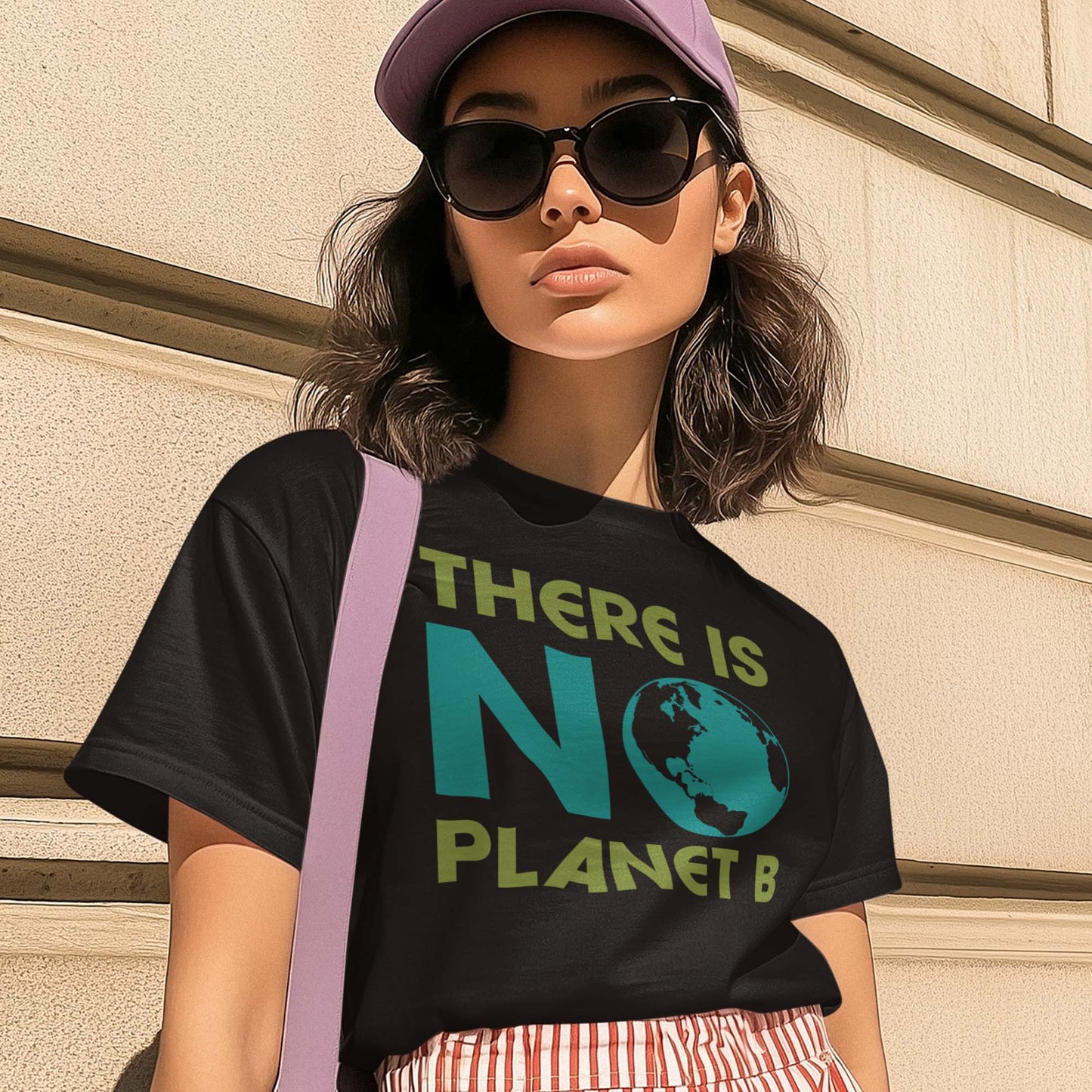Model wearing “There Is No Planet B” eco activist t-shirt with bold lettering and globe artwork.