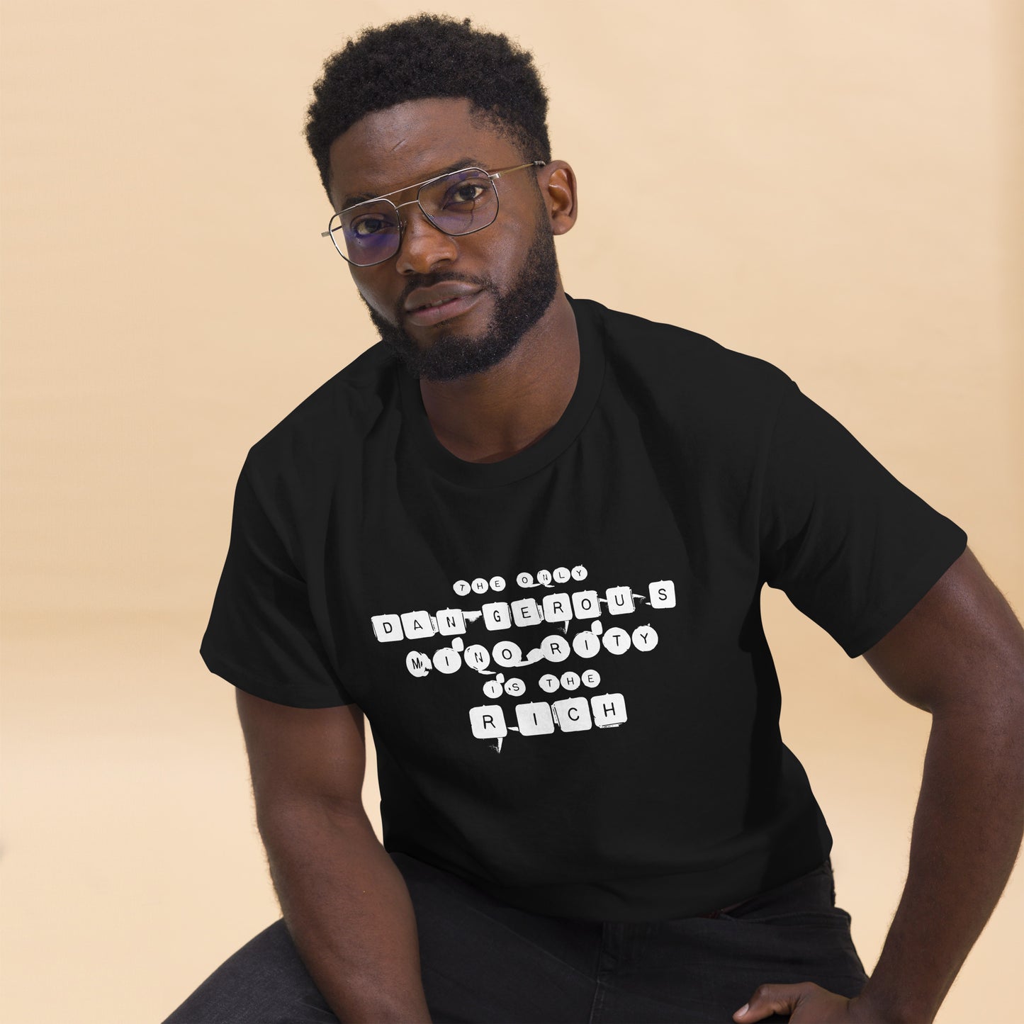 Lifestyle Image: Black Organizer Wearing Anti-Oligarchy The Only Dangerous Minority Is The Rich Tee